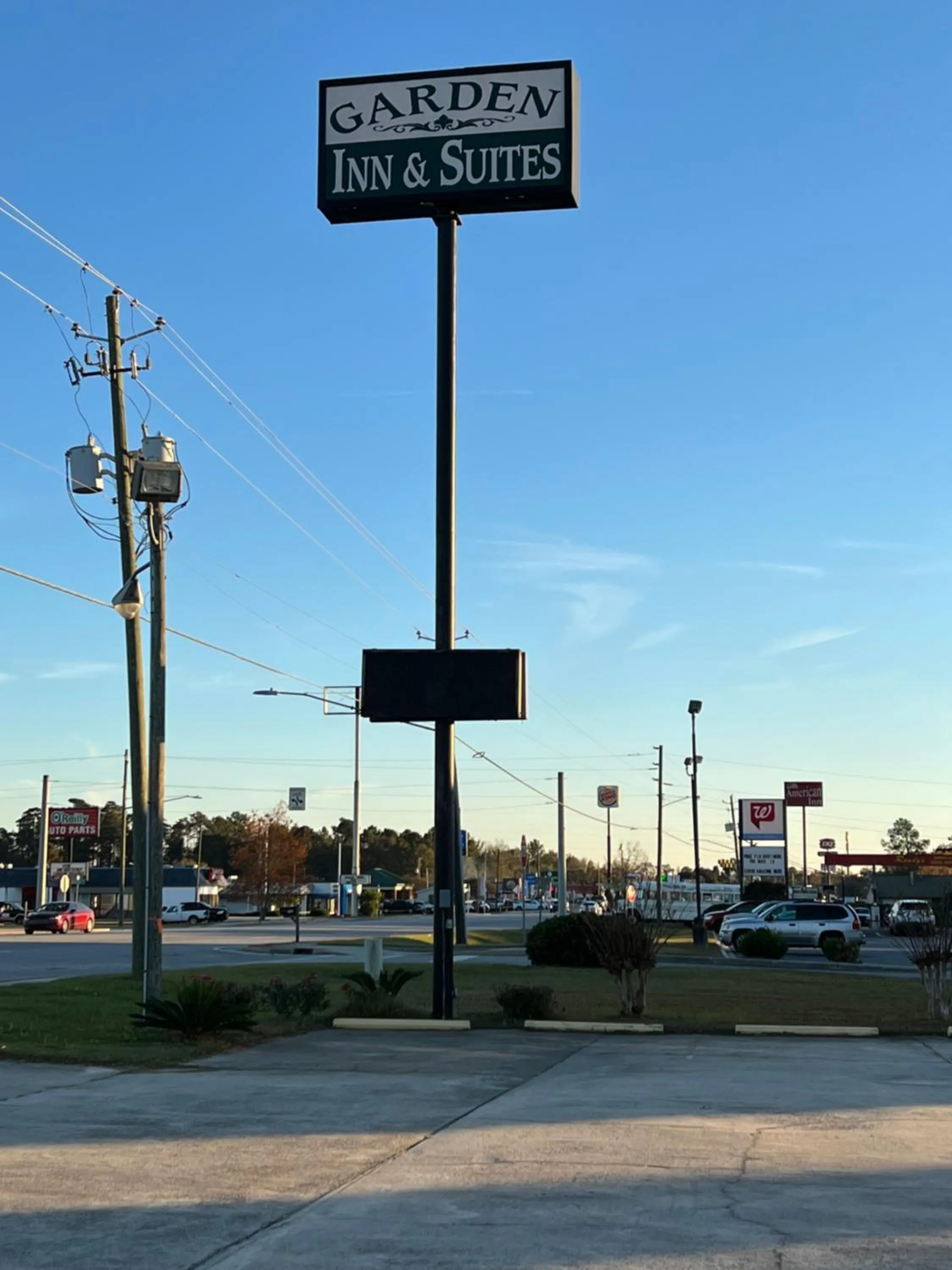 Property logo or sign in Garden Inn & Suites