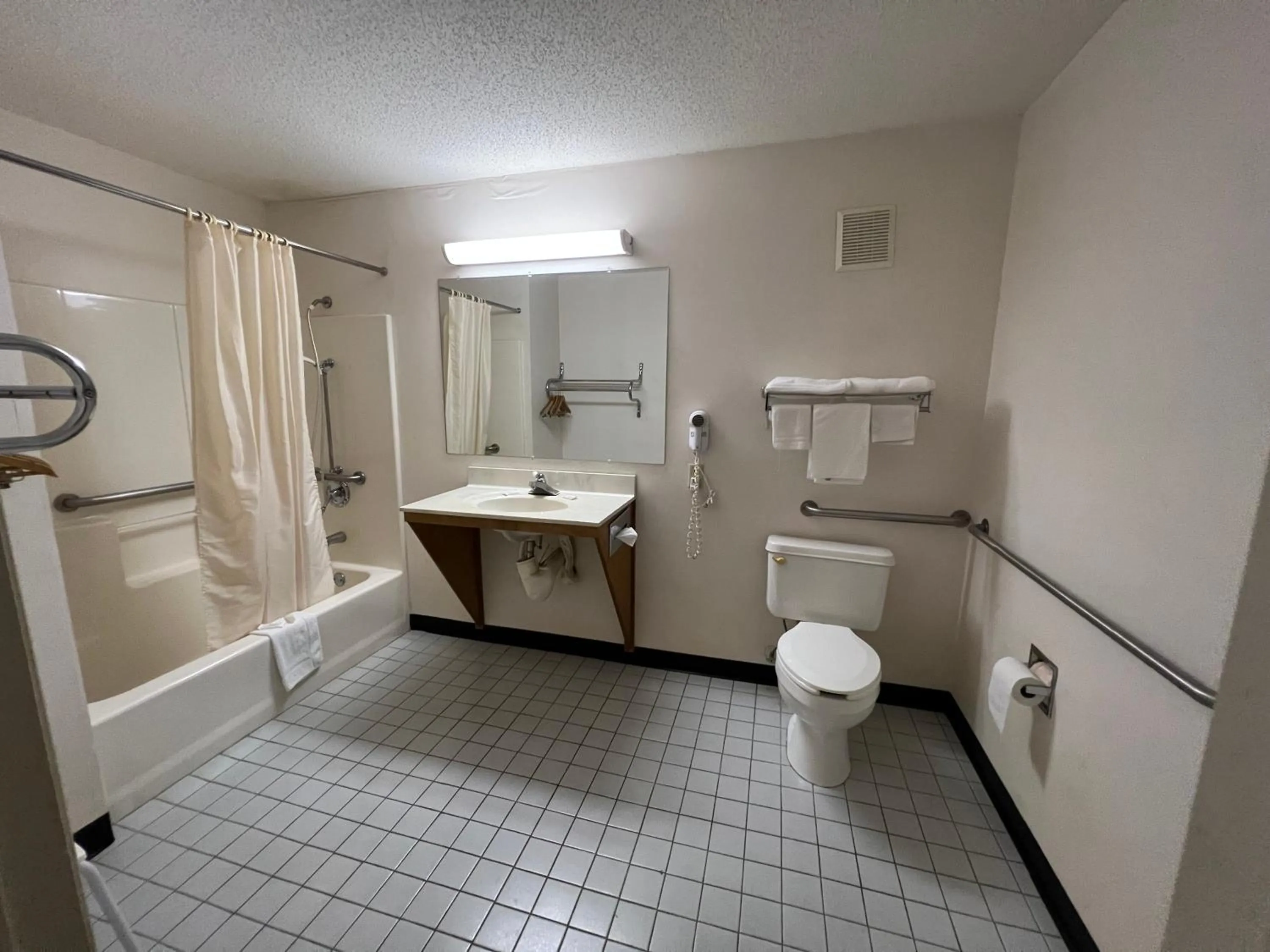 Bathroom in Garden Inn & Suites