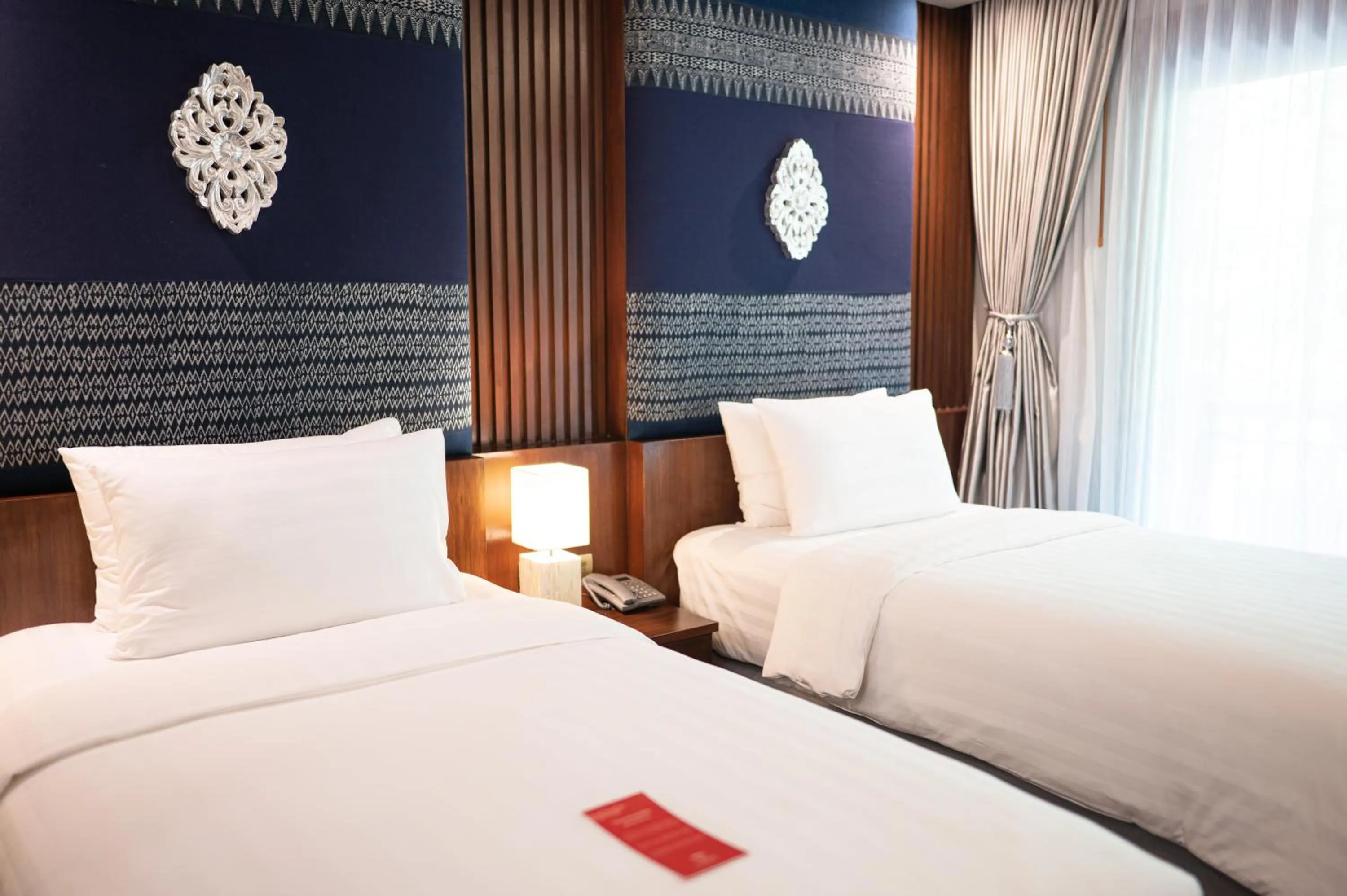 Bed in At Gate Thaphae Hotel