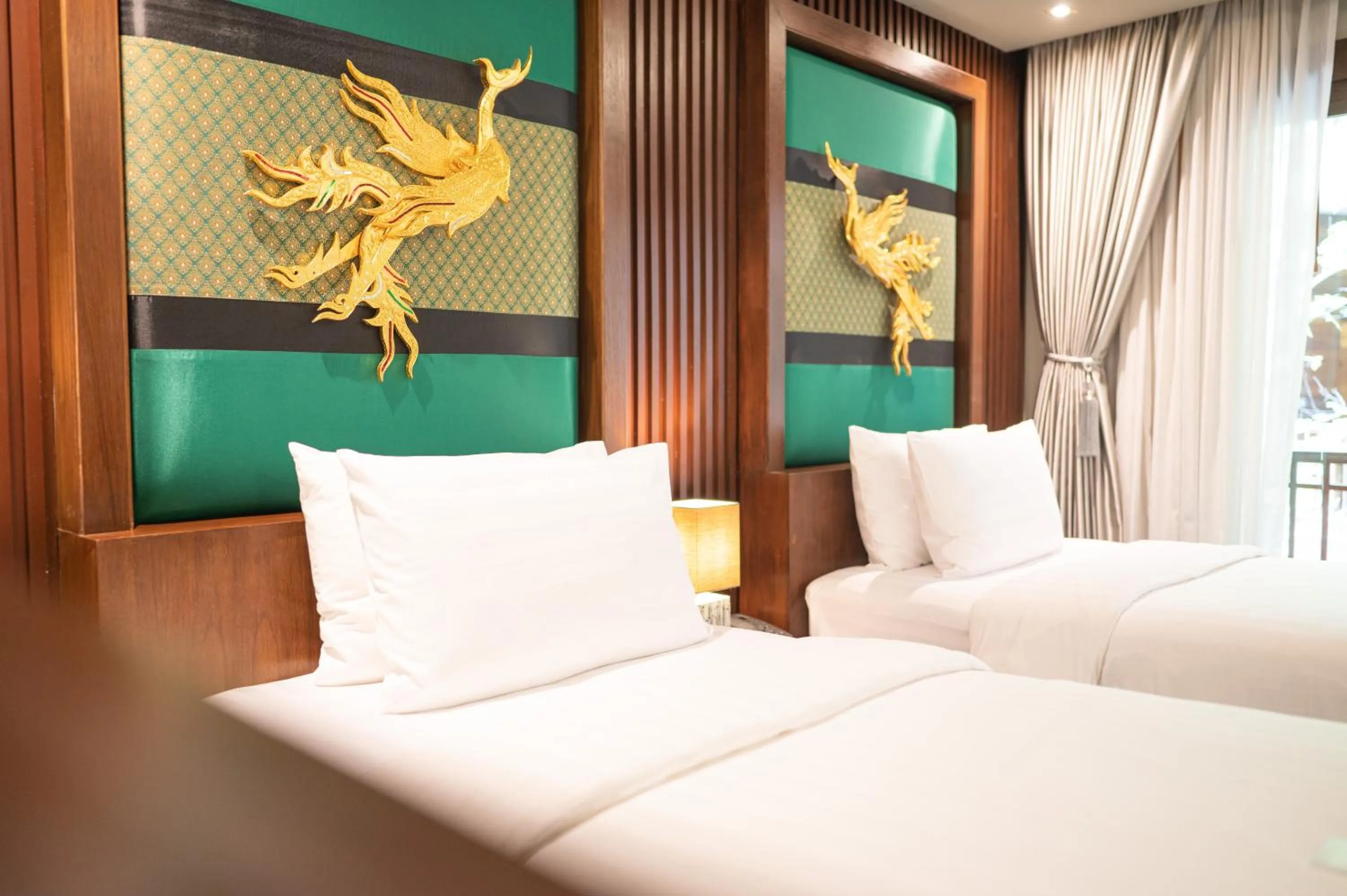 Bed in At Gate Thaphae Hotel