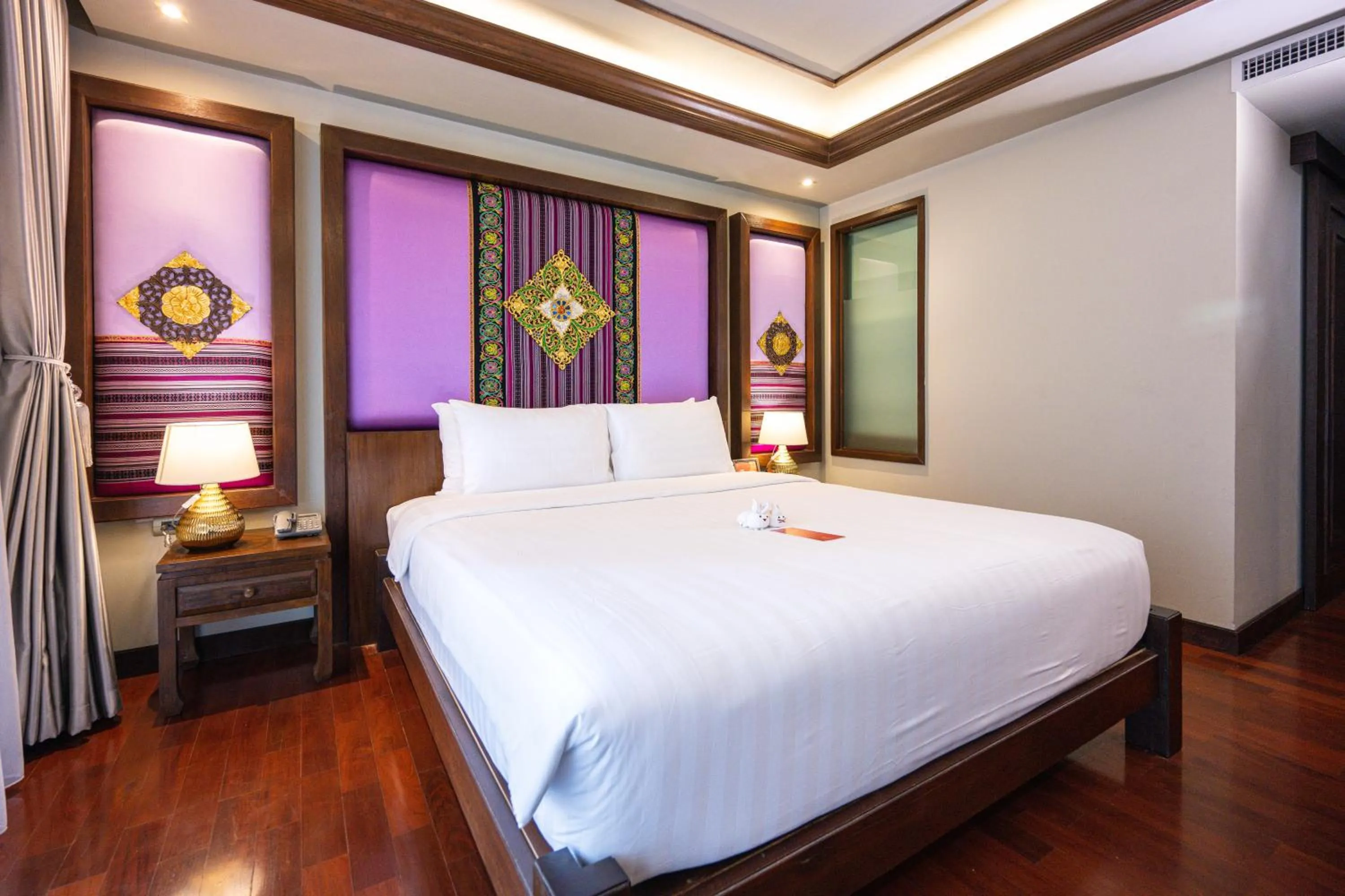 Bed in At Gate Thaphae Hotel