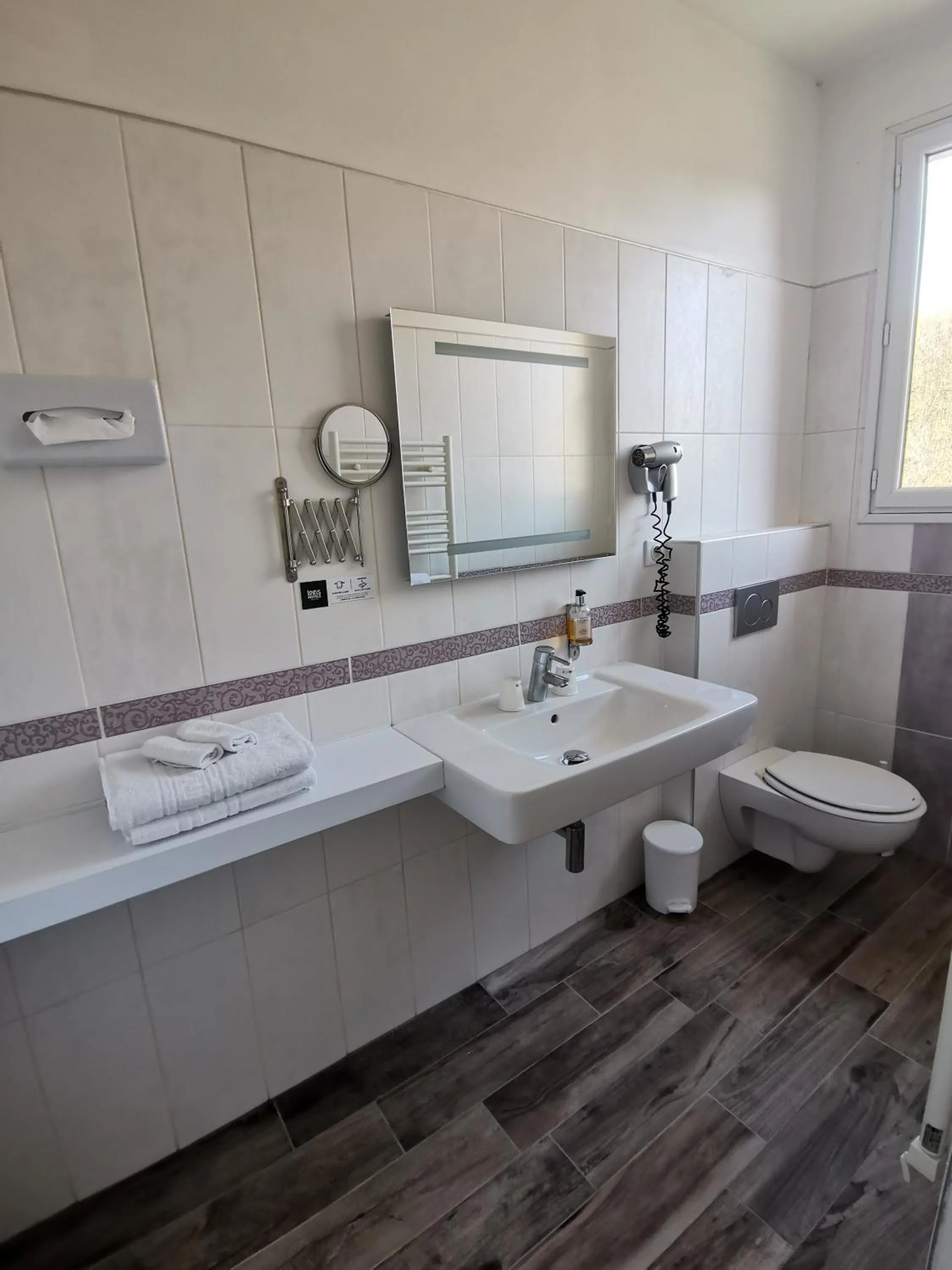 Bathroom in Logis Hotel Le Cerf