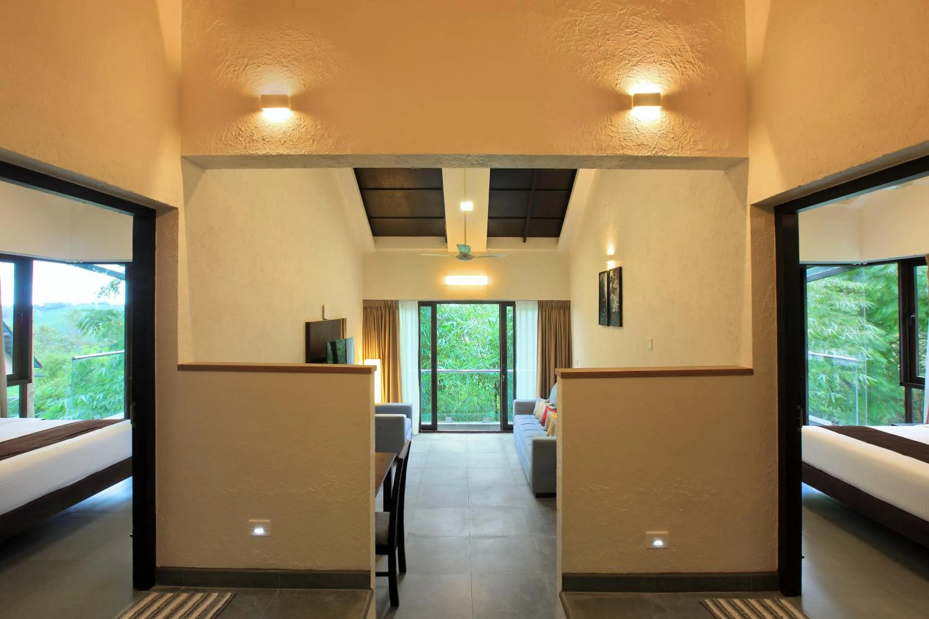 Living room, Bed in Tea Terrain Resorts & Spa