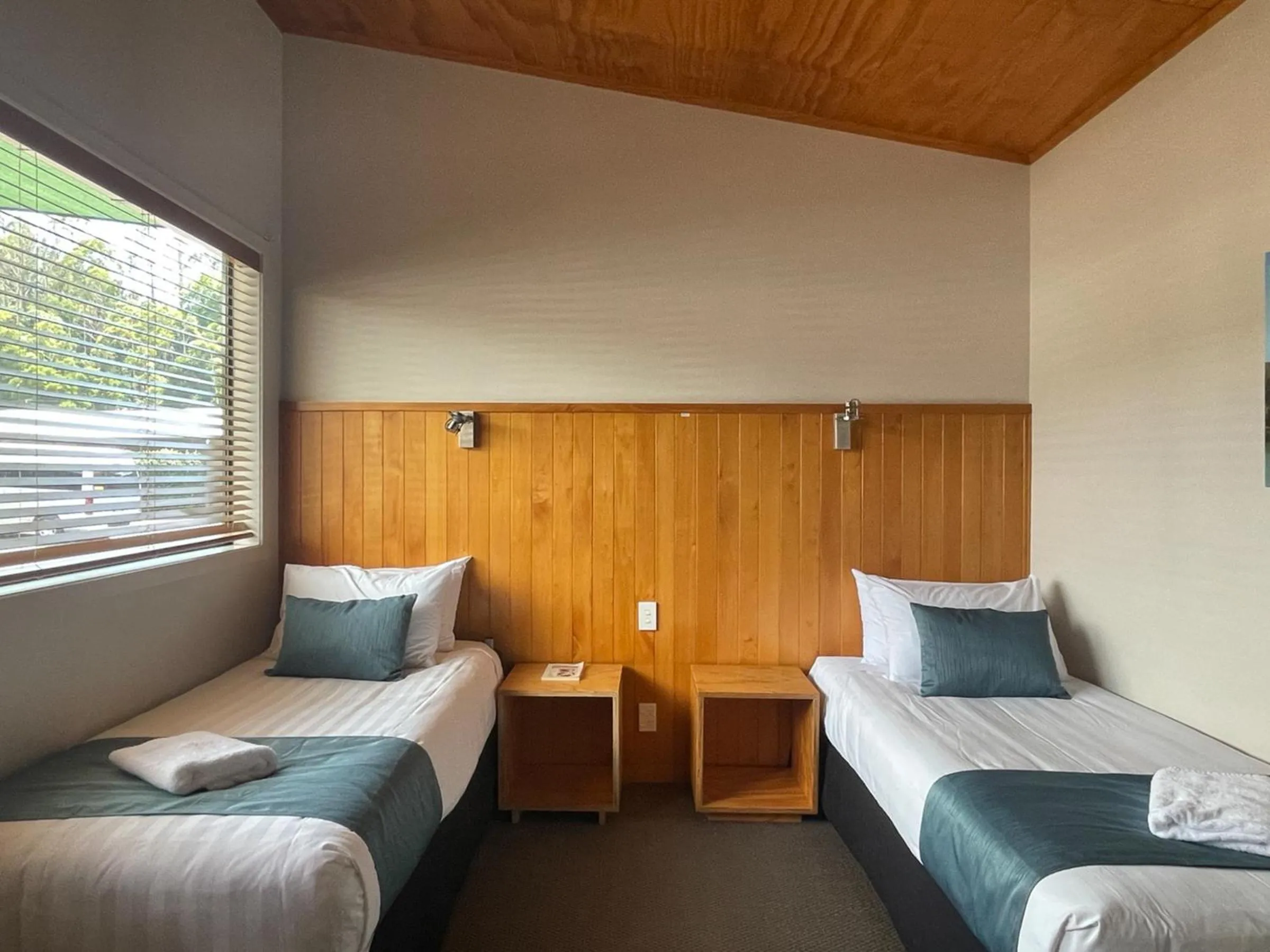 Bed in Waitomo Lodge