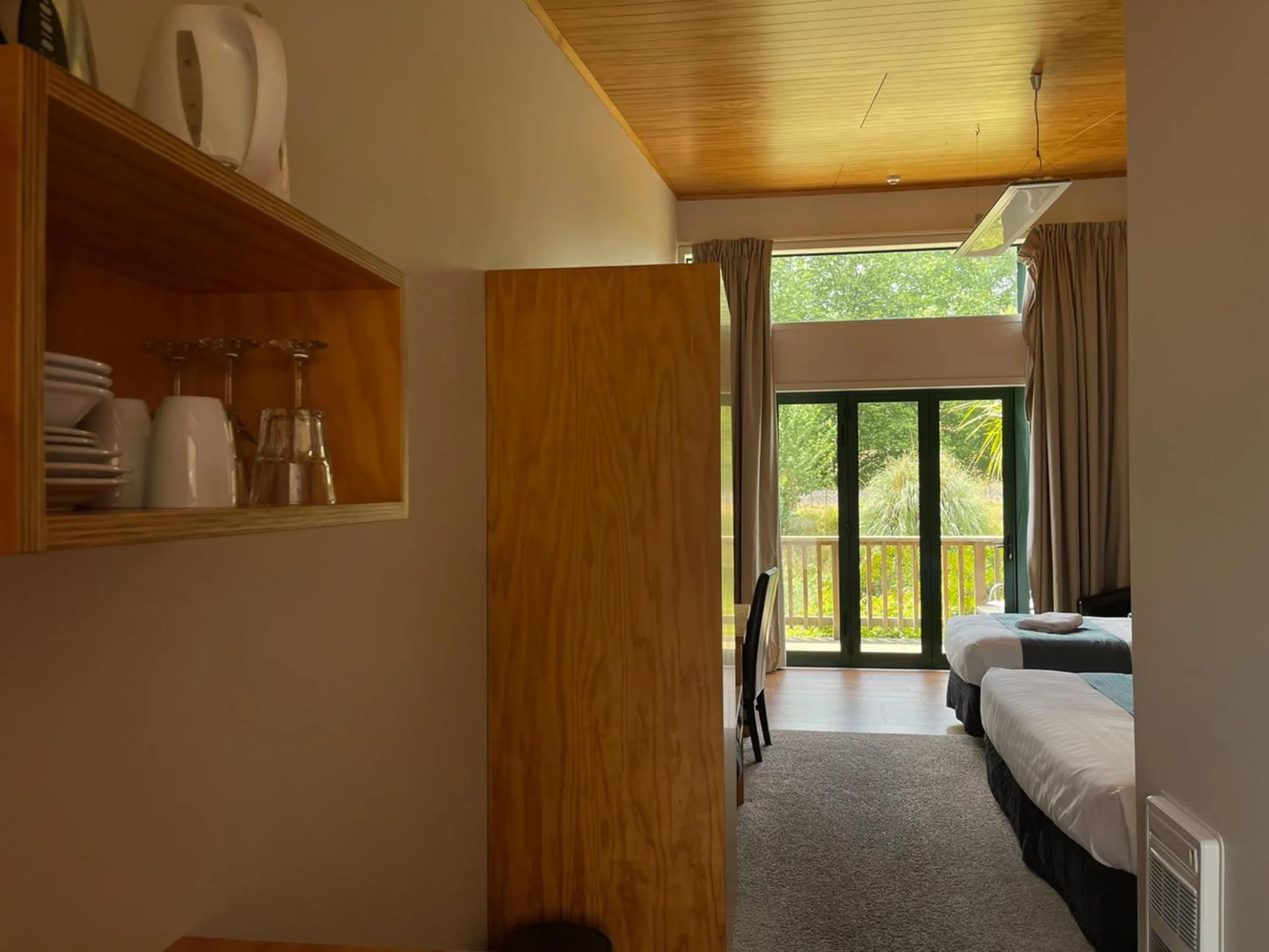 Bed in Waitomo Lodge