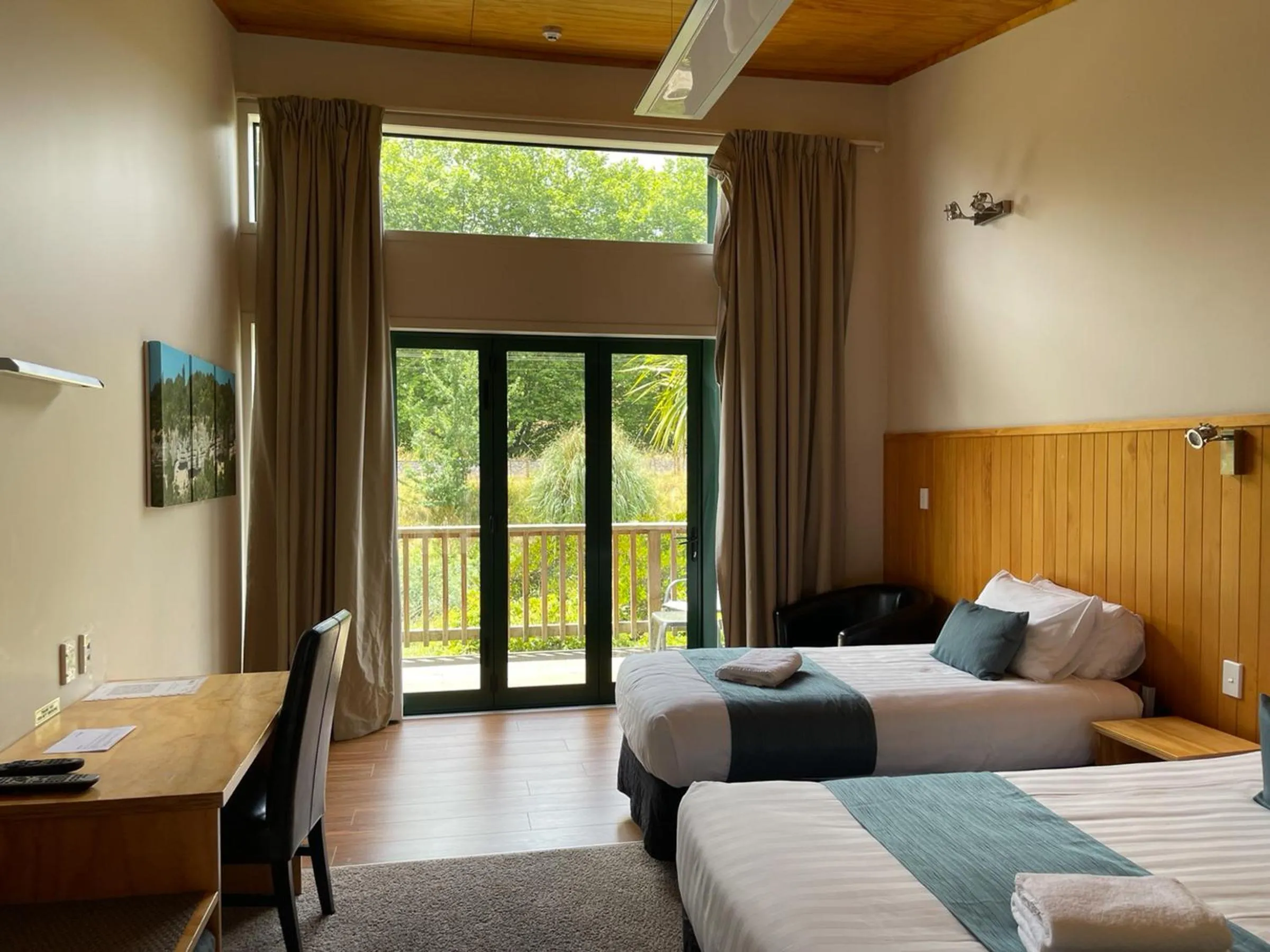 Bed in Waitomo Lodge