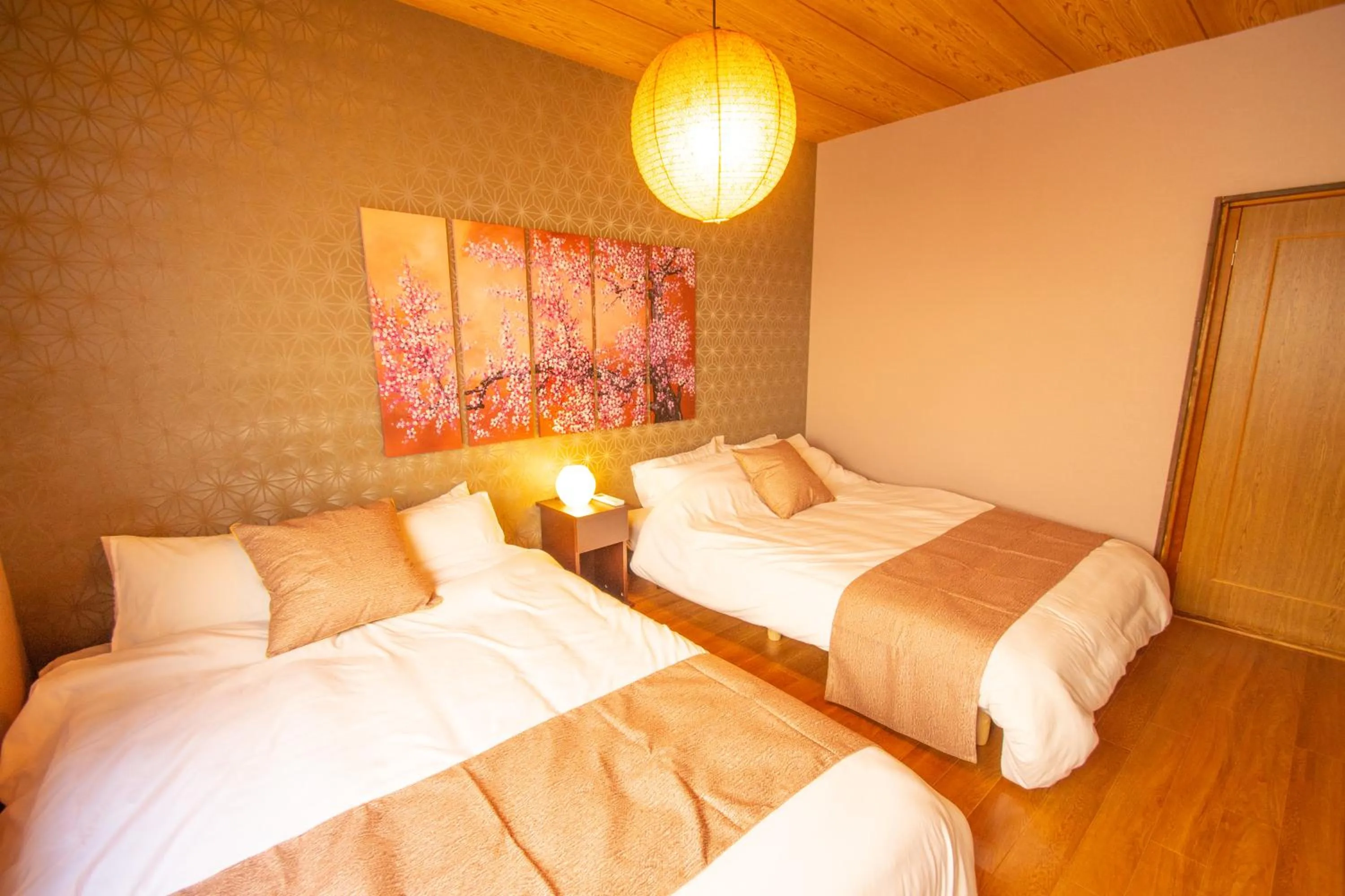 Bed in MON Kishinosato Sakura Resort -vacation rental-