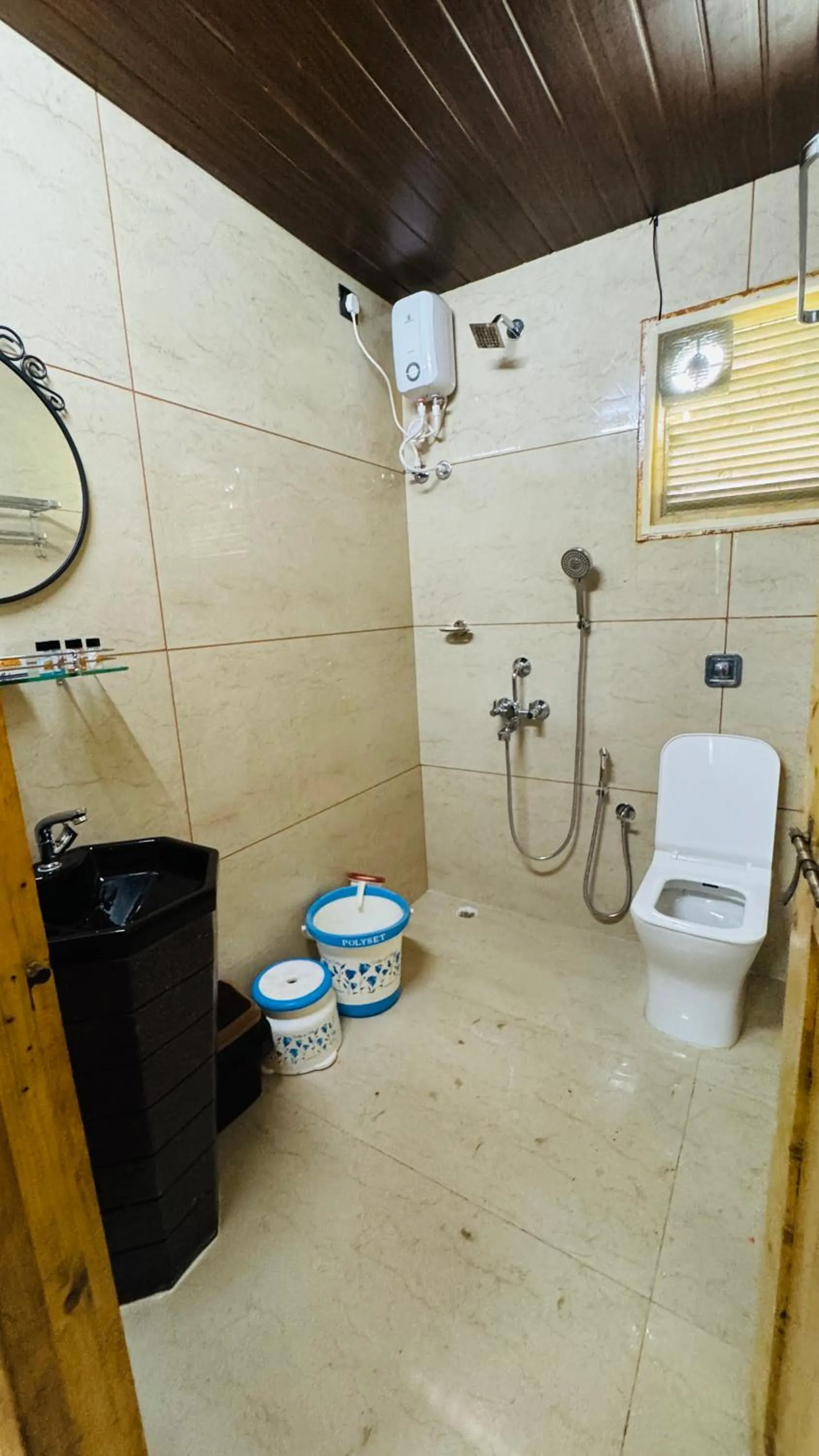 Shower in Coastal Bay Inn by Green Apple Stays