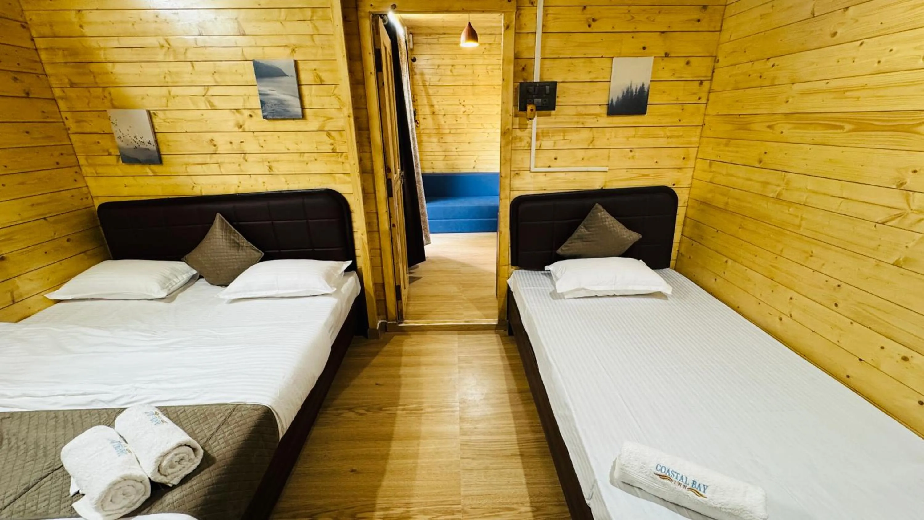 Bed in Coastal Bay Inn by Green Apple Stays