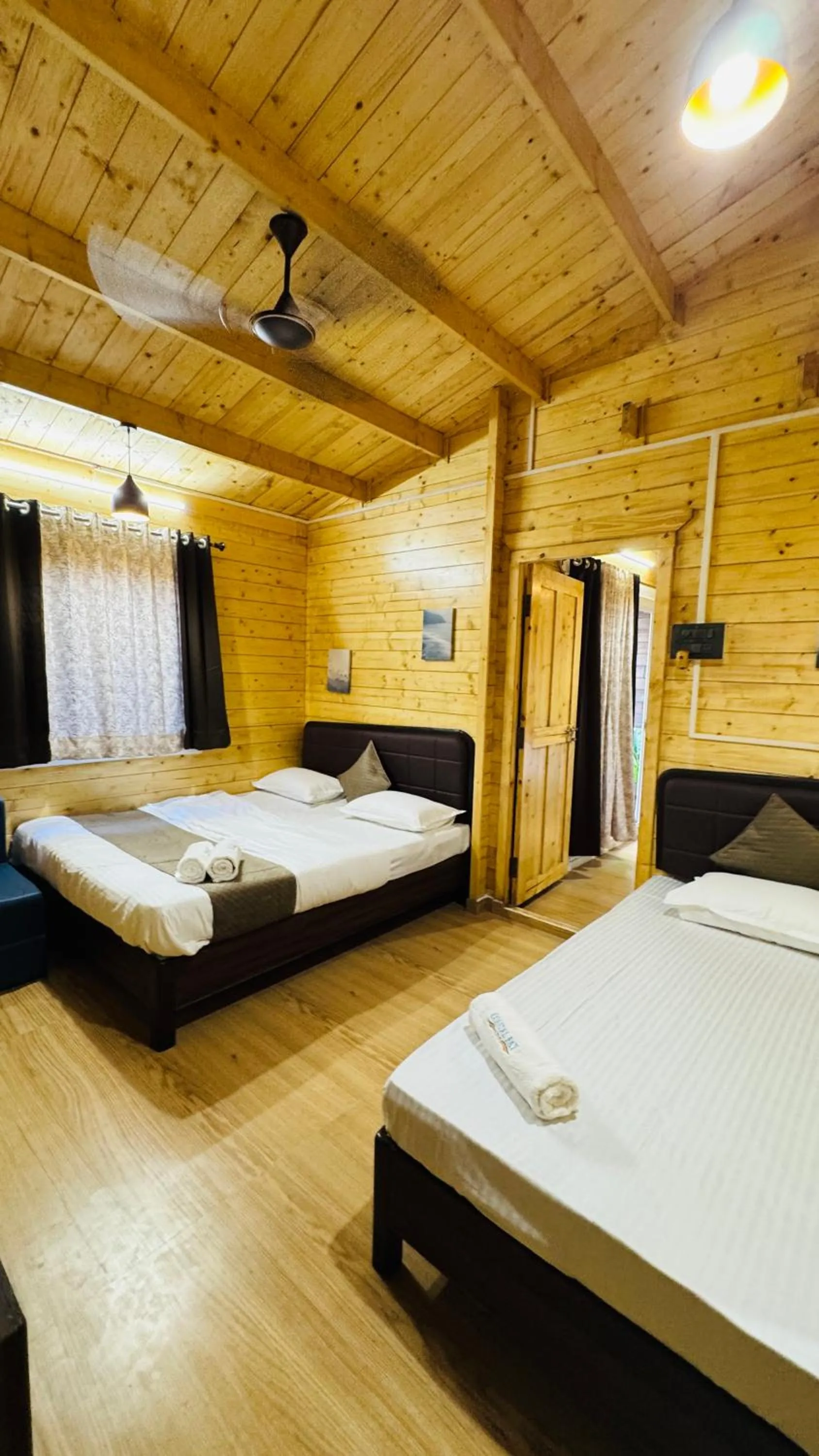 Bed in Coastal Bay Inn by Green Apple Stays