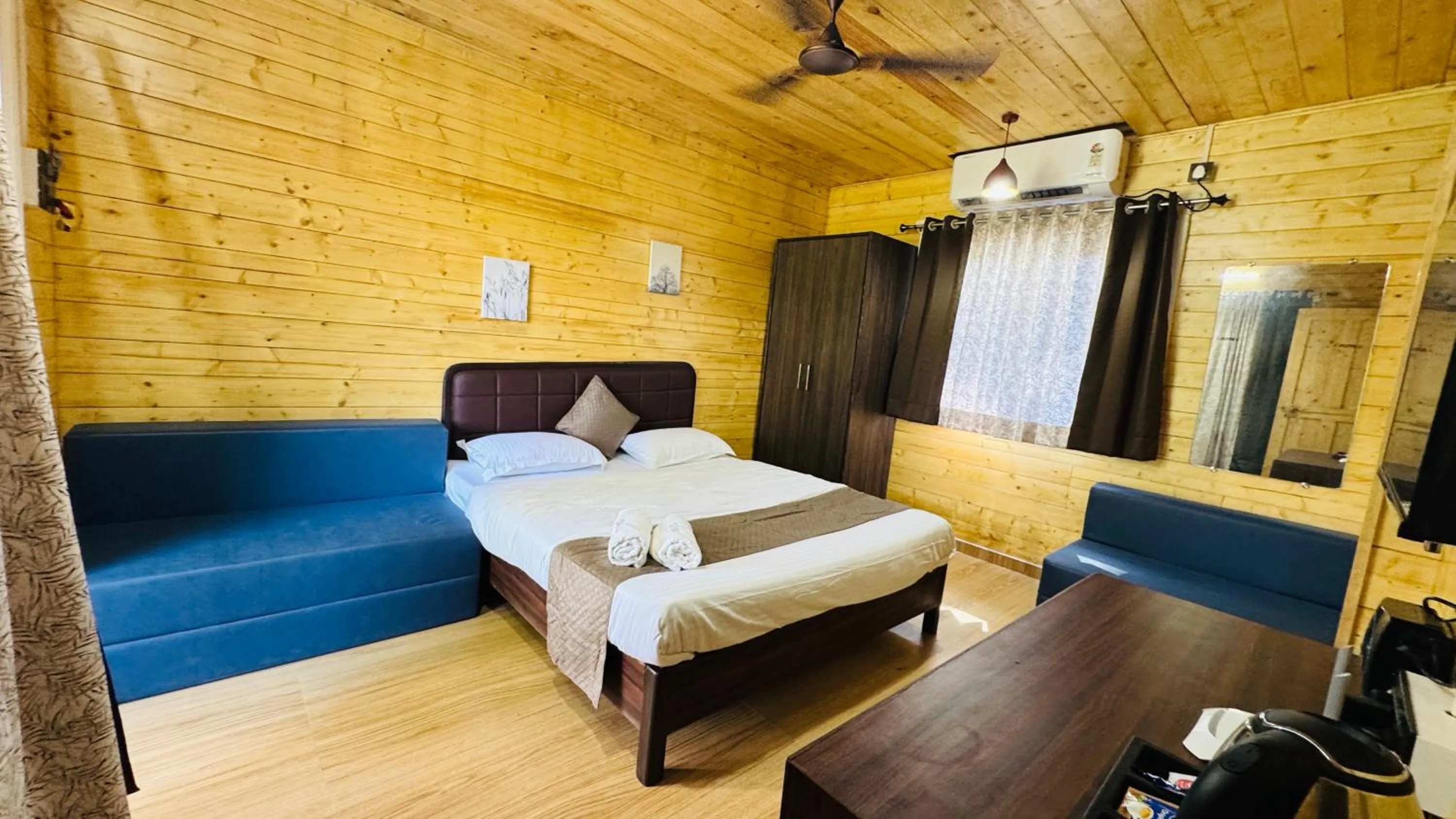 Bed in Coastal Bay Inn by Green Apple Stays