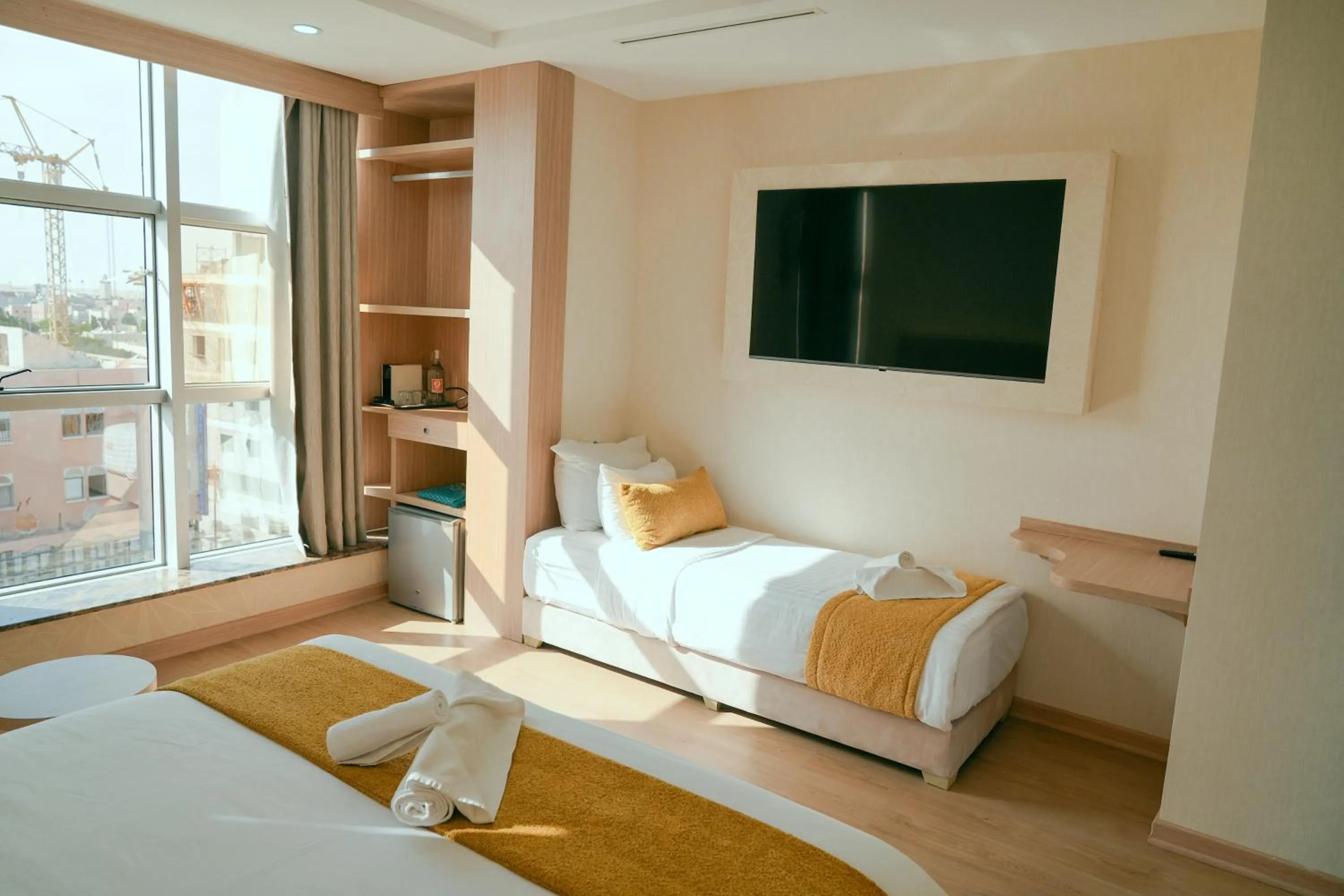 Communal lounge/ TV room, Bed in Sahariano hotel City Center