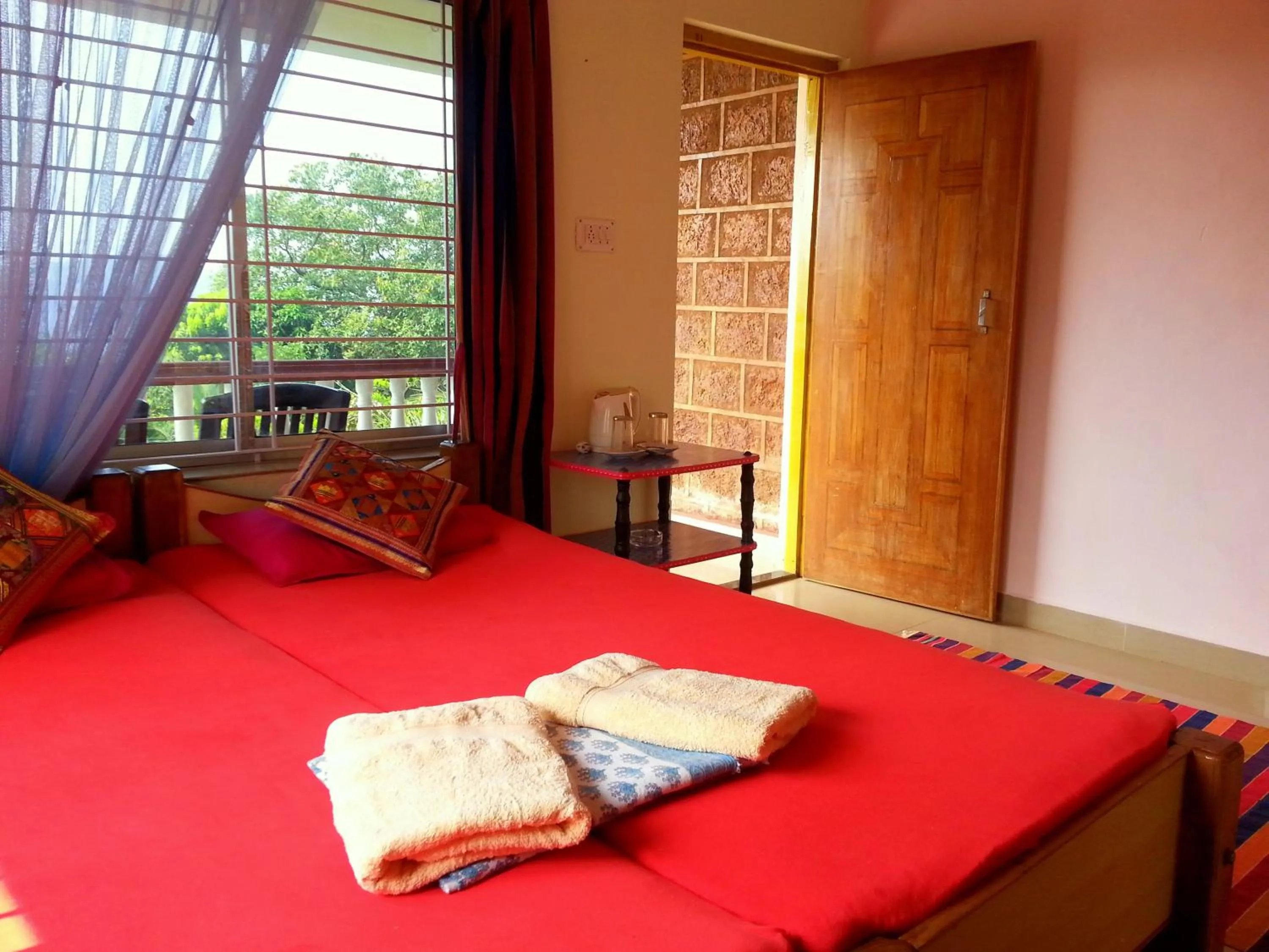 Photo of the whole room, Bed in Namaste Yoga Farm