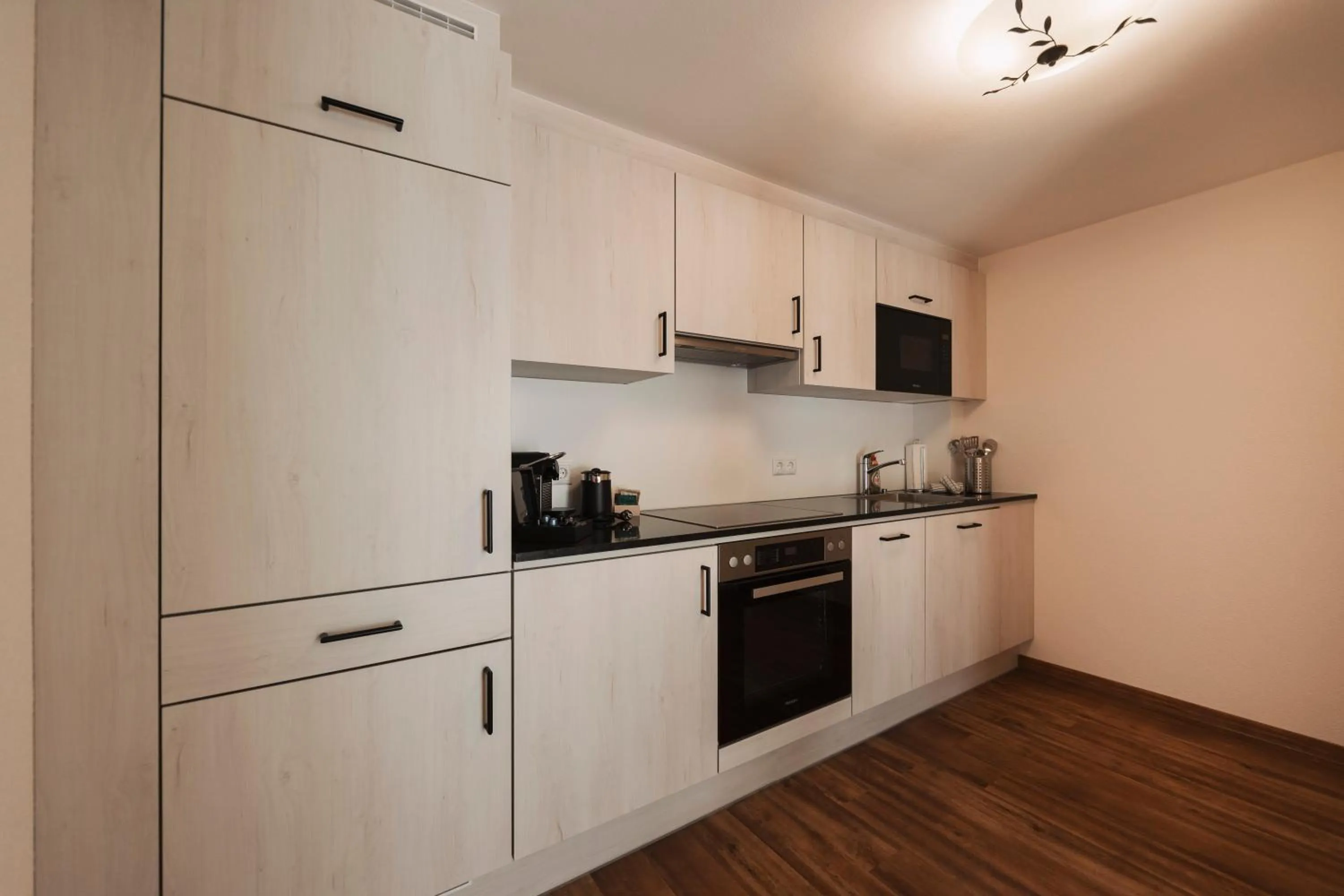 Kitchen or kitchenette in Wellness Aparthotel Panorama Alpin - Ferienwohnungen Jerzens im Pitztal