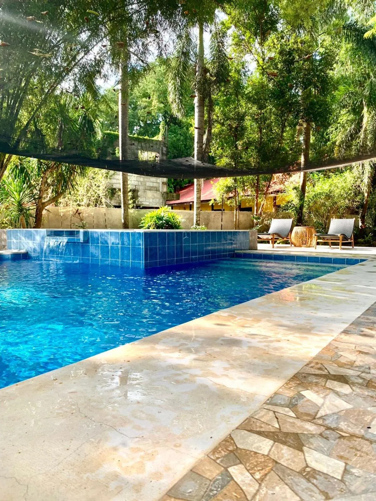 Swimming pool in The Henry Resort Taramindu Laiya