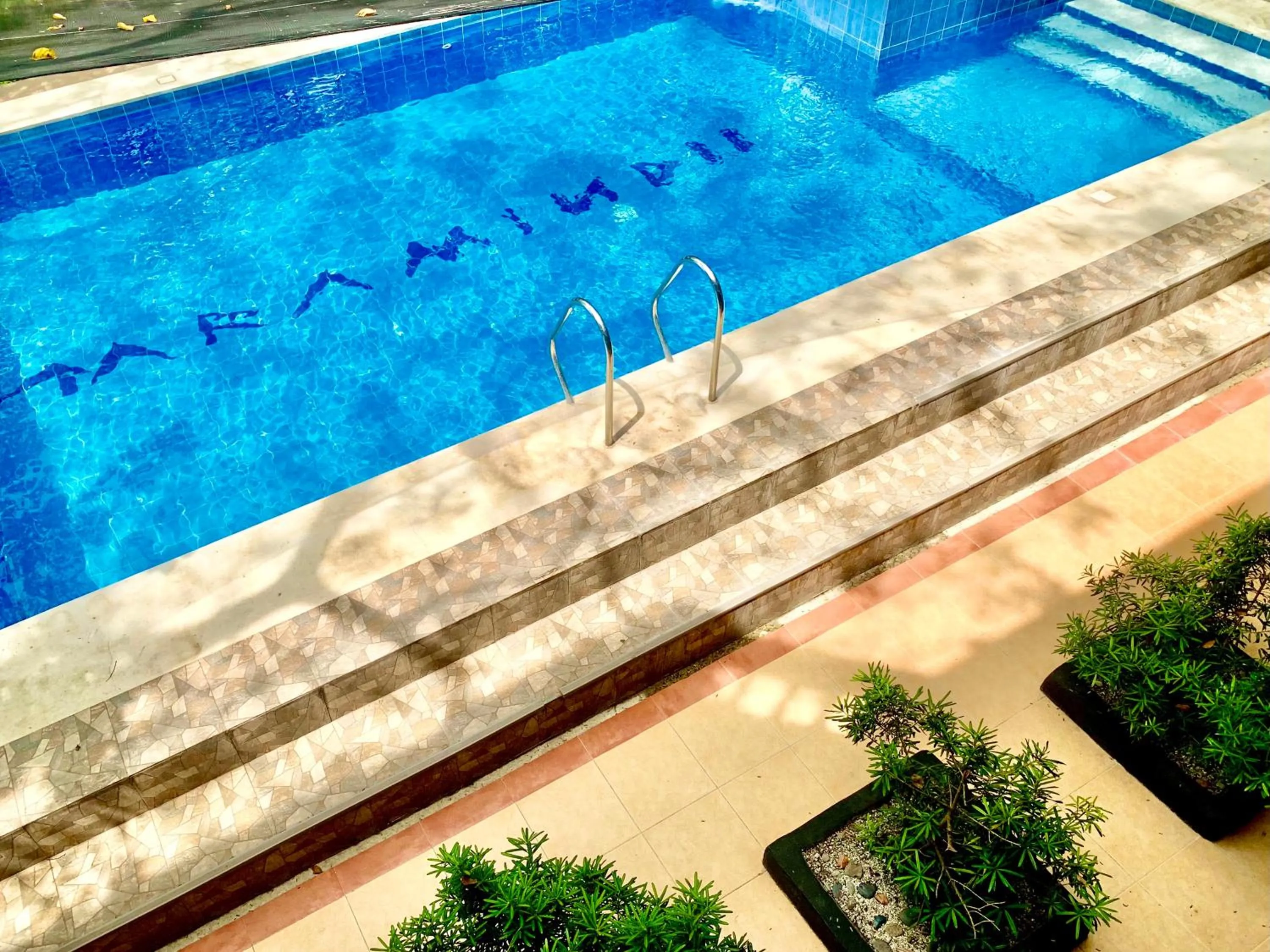Swimming pool in The Henry Resort Taramindu Laiya
