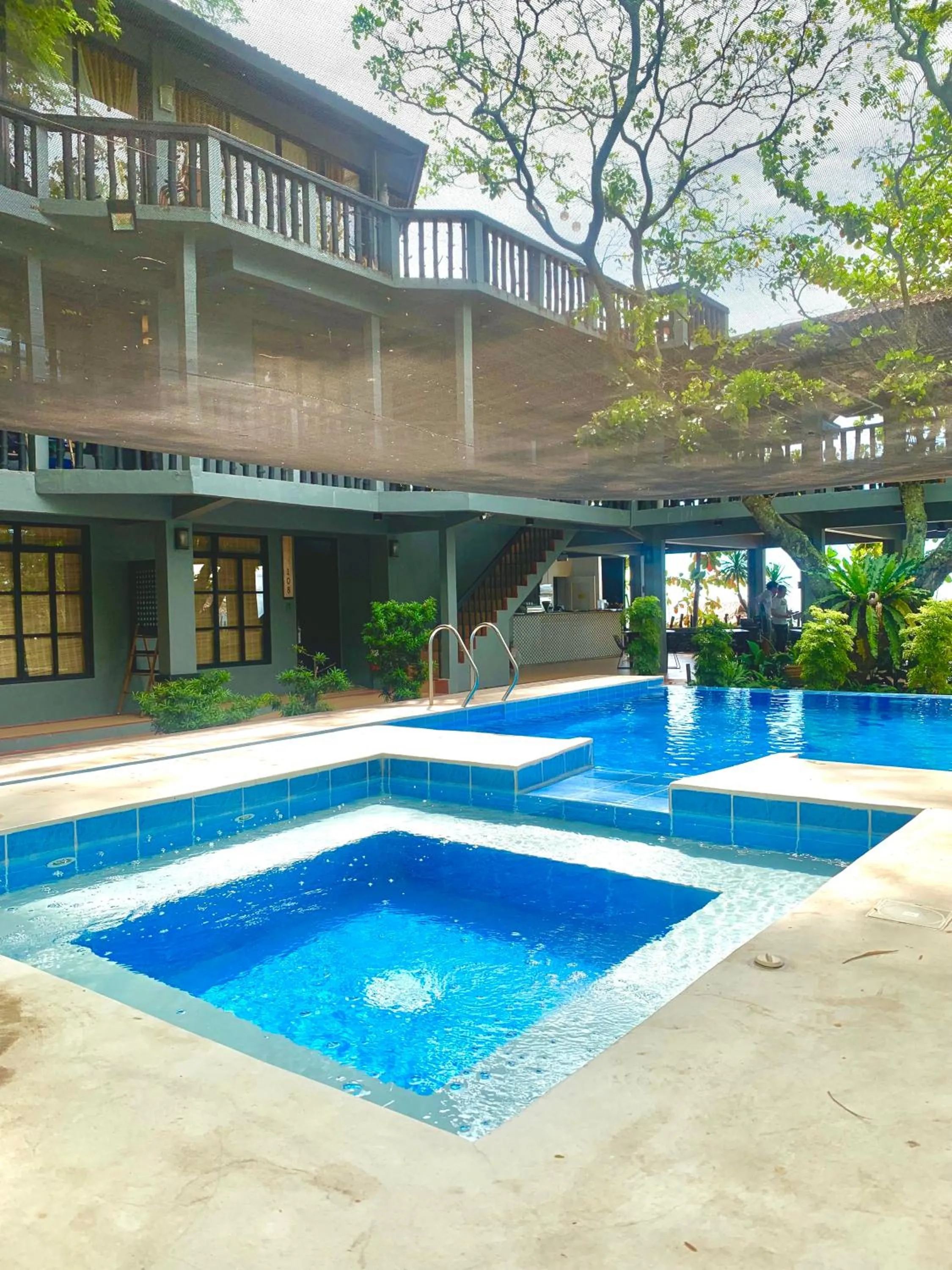 Pool view in The Henry Resort Taramindu Laiya