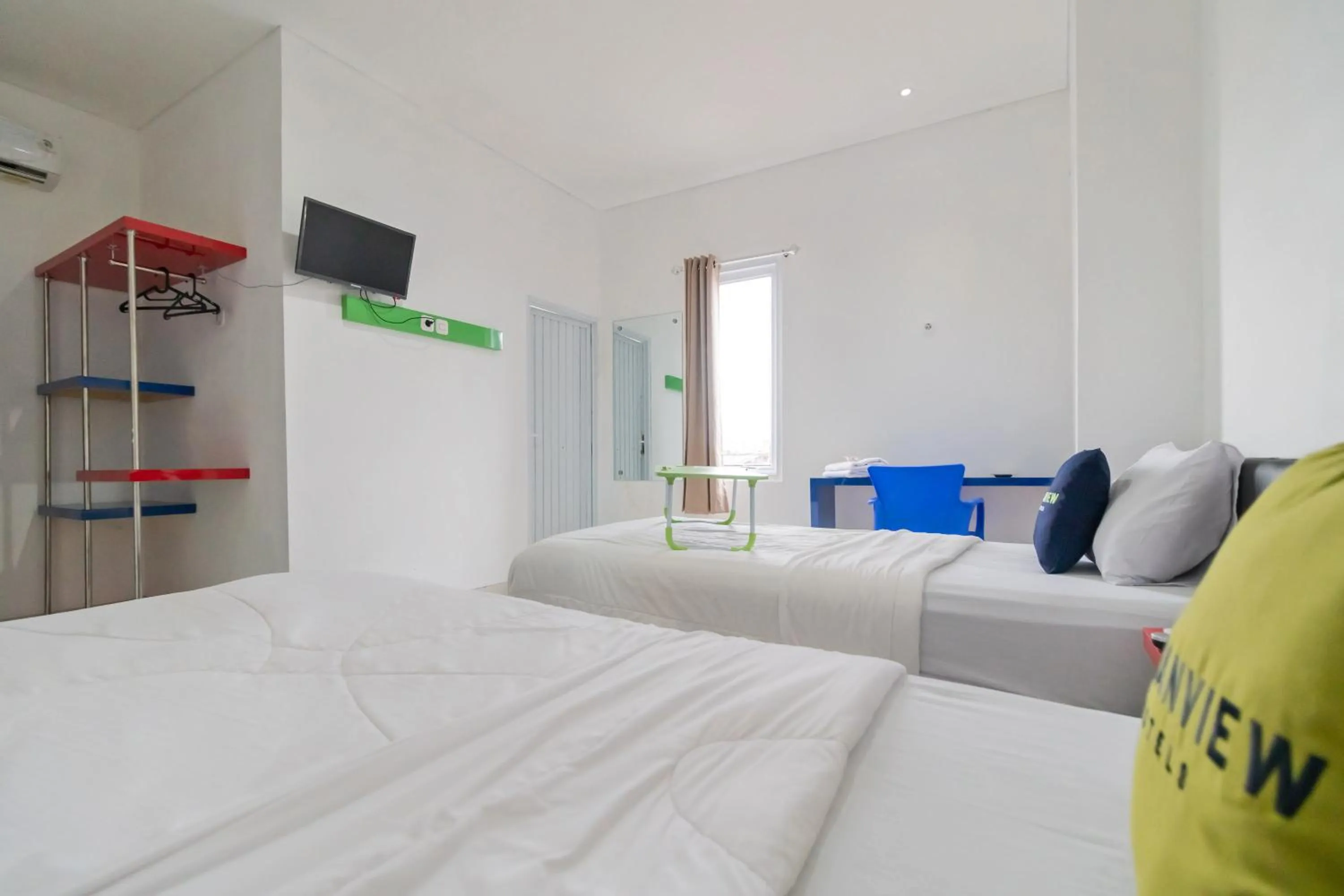 Photo of the whole room, Bed in Urbanview Hotel Ephe Palembang by RedDoorz