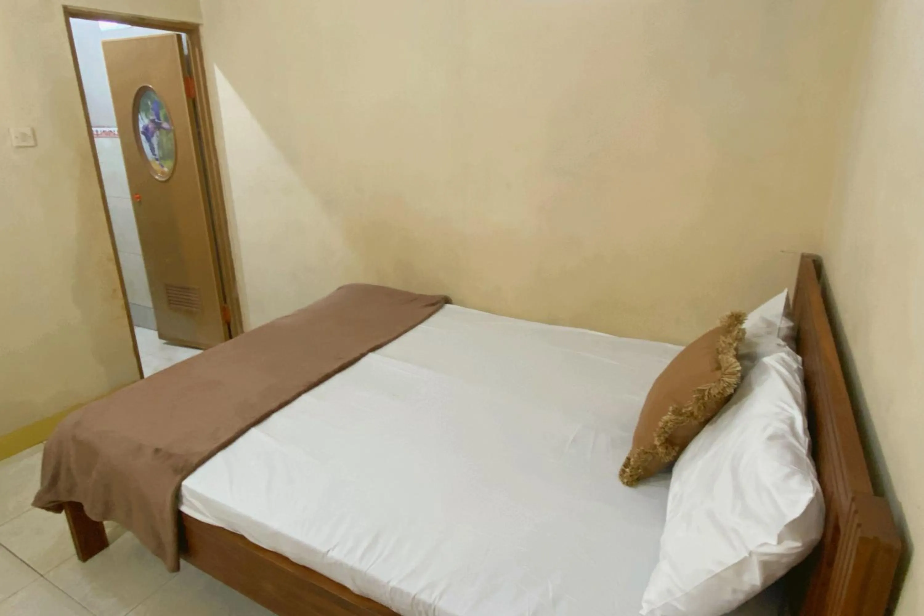 Bedroom, Bed in Central House Karimunjawa Mitra RedDoorz