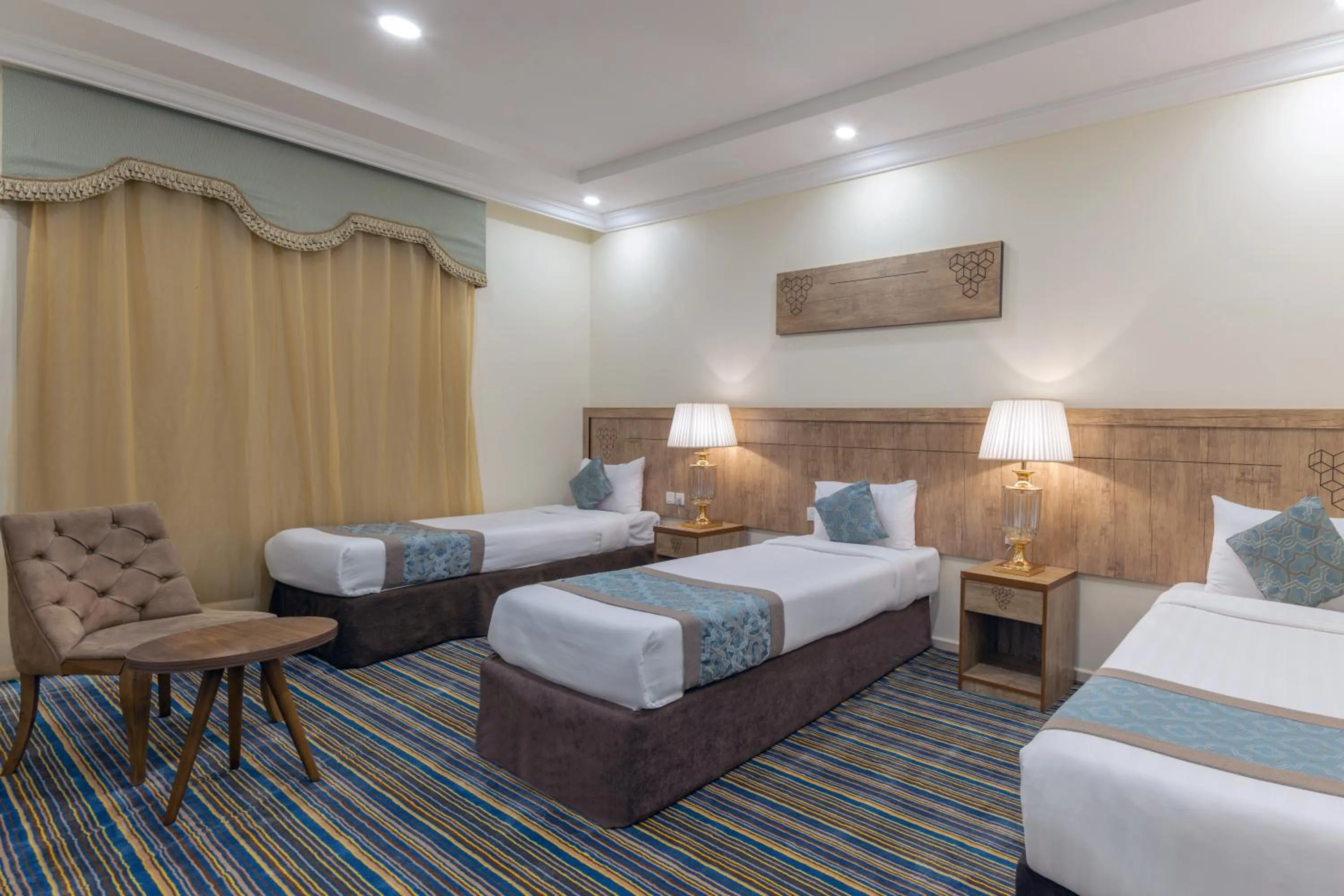 Bed in Snood Al Dana Hotel