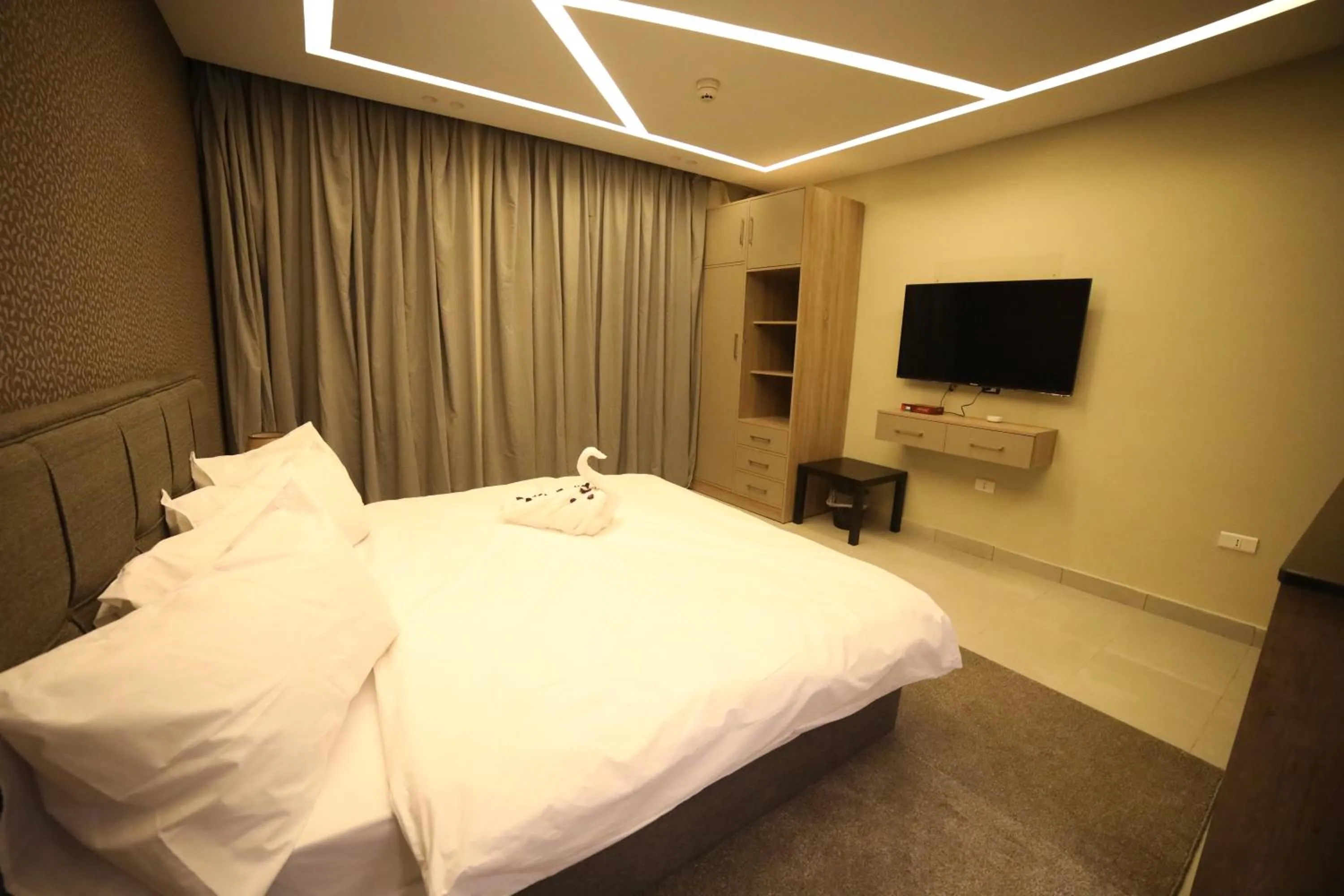 Bed in فندق صحارى الخليج Sahara Gulf Hotel Apartments