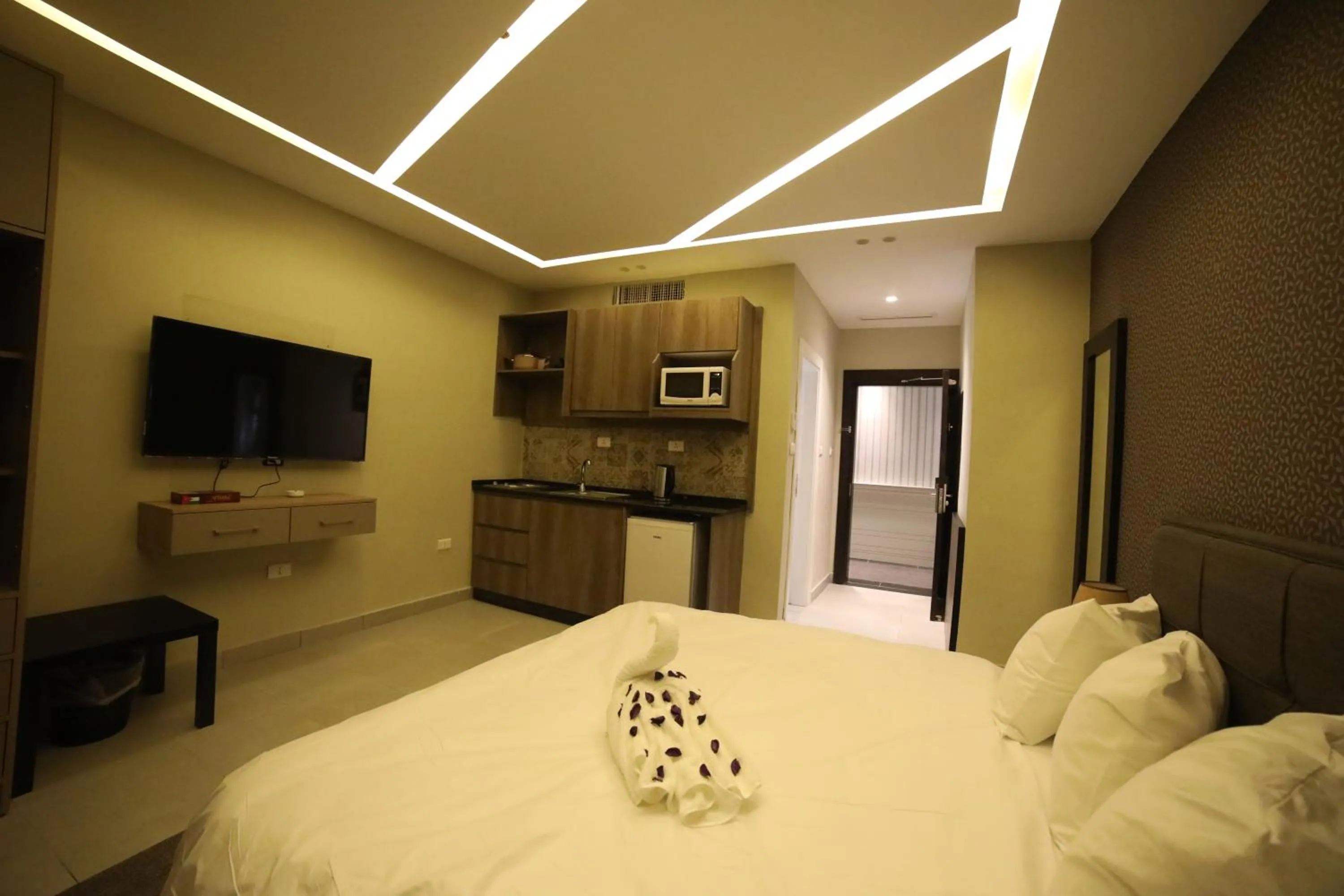 Bed in فندق صحارى الخليج Sahara Gulf Hotel Apartments