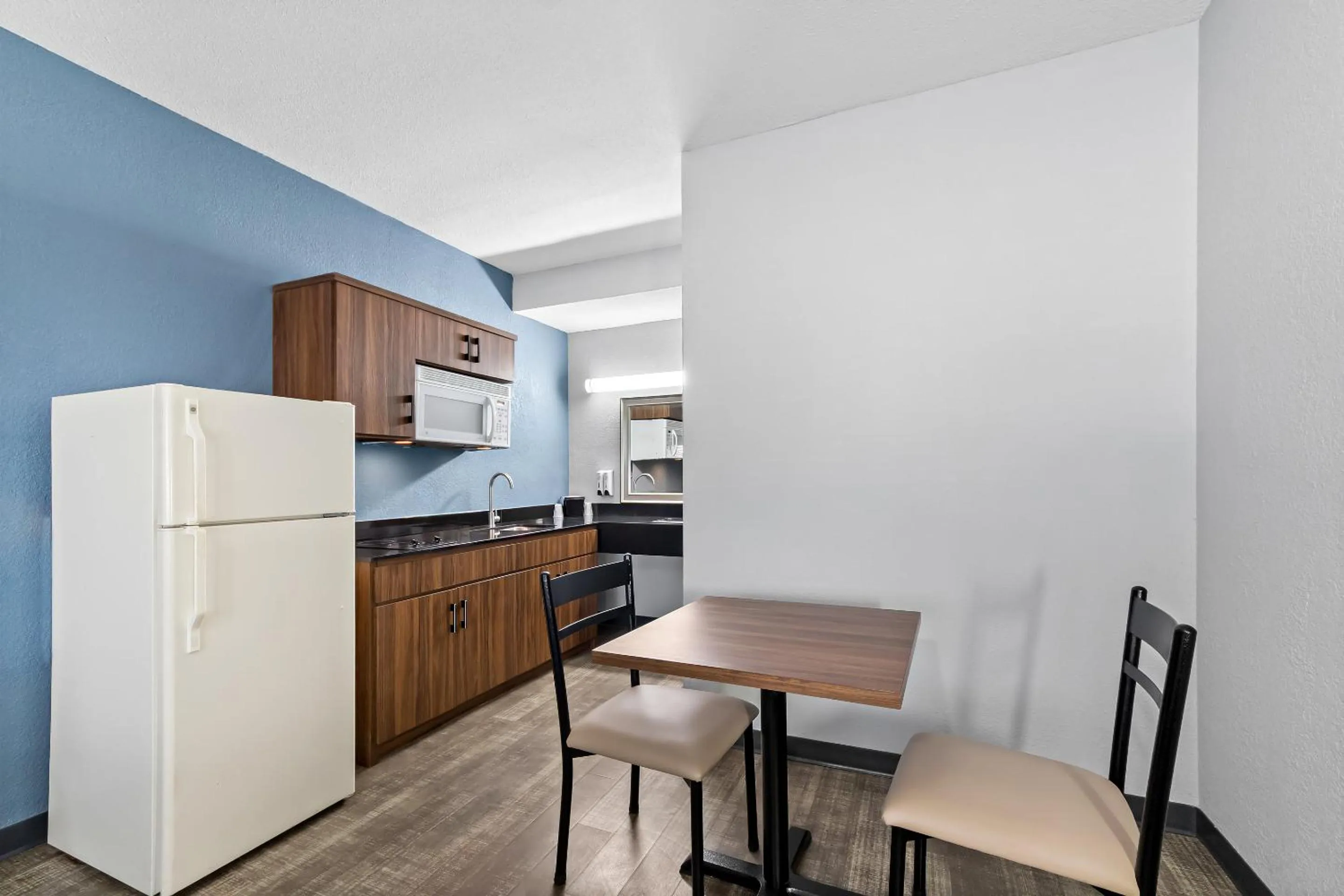 Photo of the whole room in HomeTowne Studios by Red Roof San Antonio E - Frost Bank Center