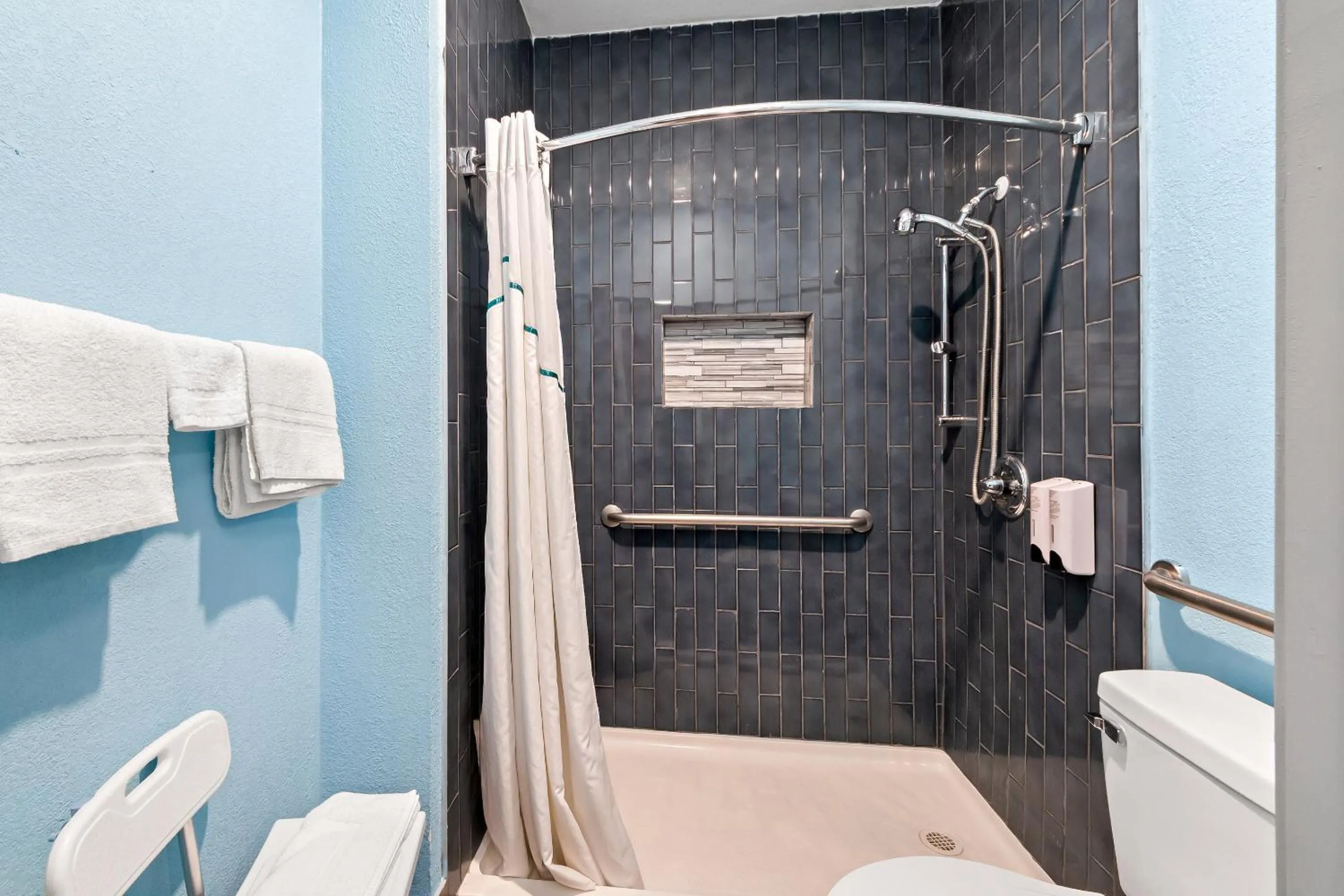 Bathroom in HomeTowne Studios by Red Roof San Antonio E - Frost Bank Center