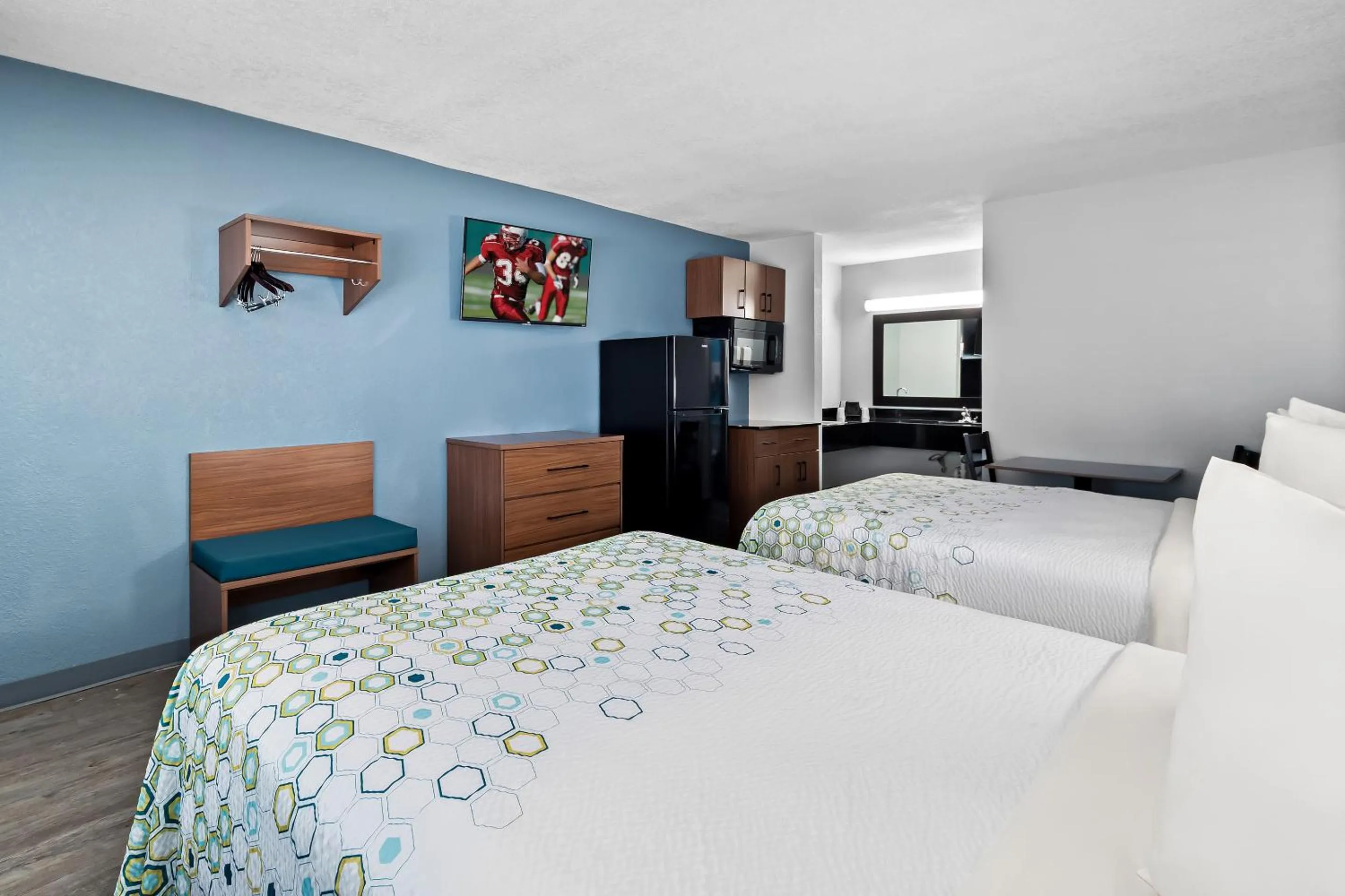 Photo of the whole room, Bed in HomeTowne Studios by Red Roof San Antonio E - Frost Bank Center