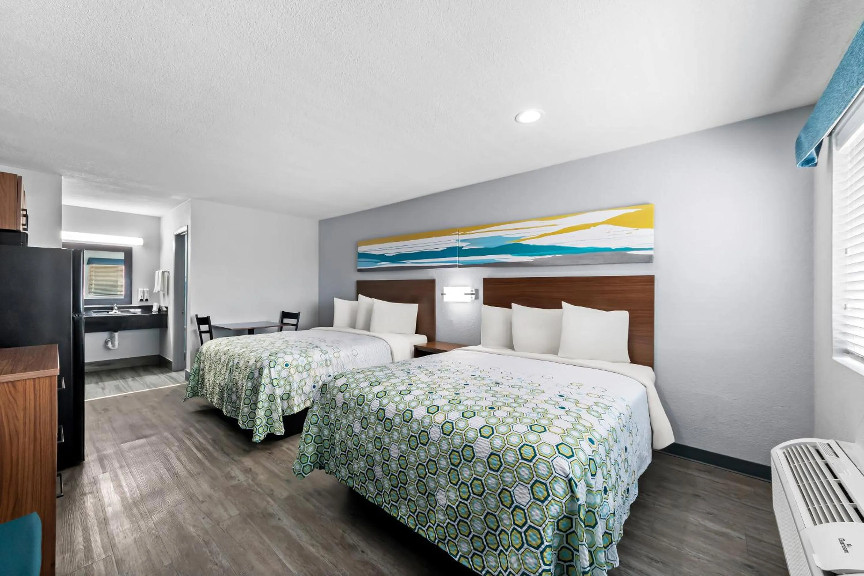 Photo of the whole room, Bed in HomeTowne Studios by Red Roof San Antonio E - Frost Bank Center