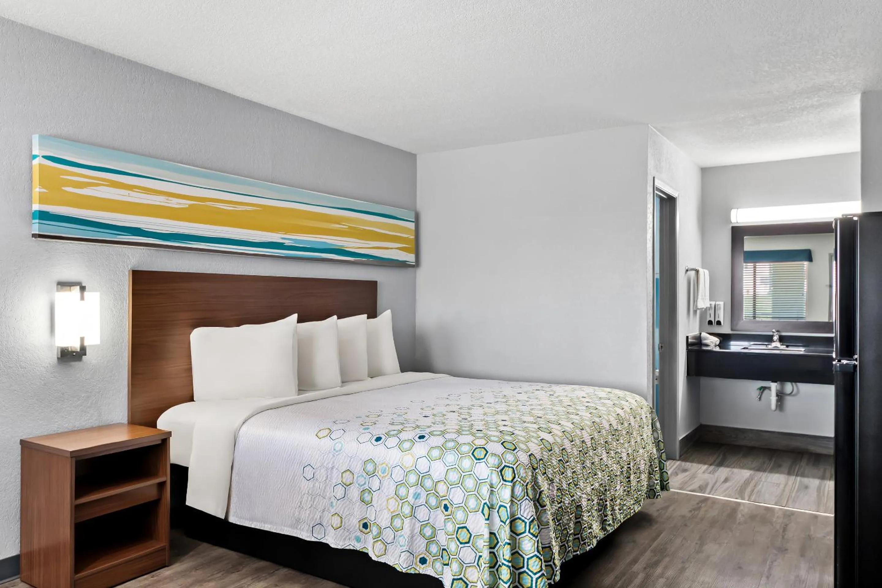 Photo of the whole room, Bed in HomeTowne Studios by Red Roof San Antonio E - Frost Bank Center