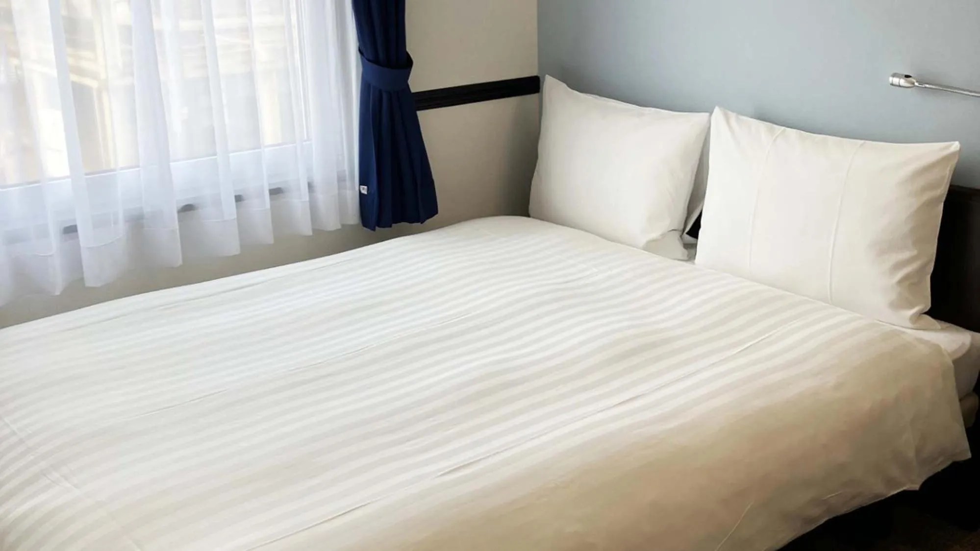 Bedroom, Bed in Toyoko Inn Shin takaoka eki Shinkansen Minami guchi