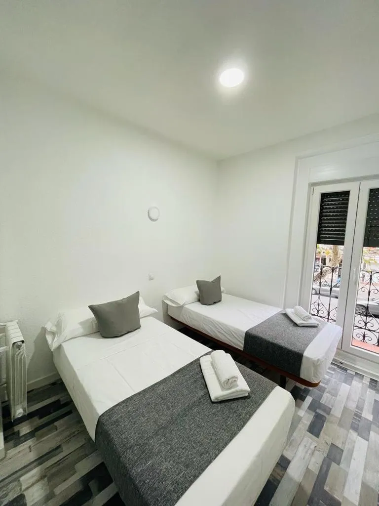 Bed in HOSTAL Noche y Dia