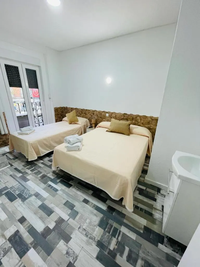 Bed in HOSTAL Noche y Dia