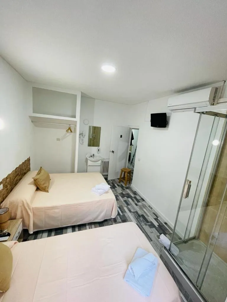 Bed in HOSTAL Noche y Dia