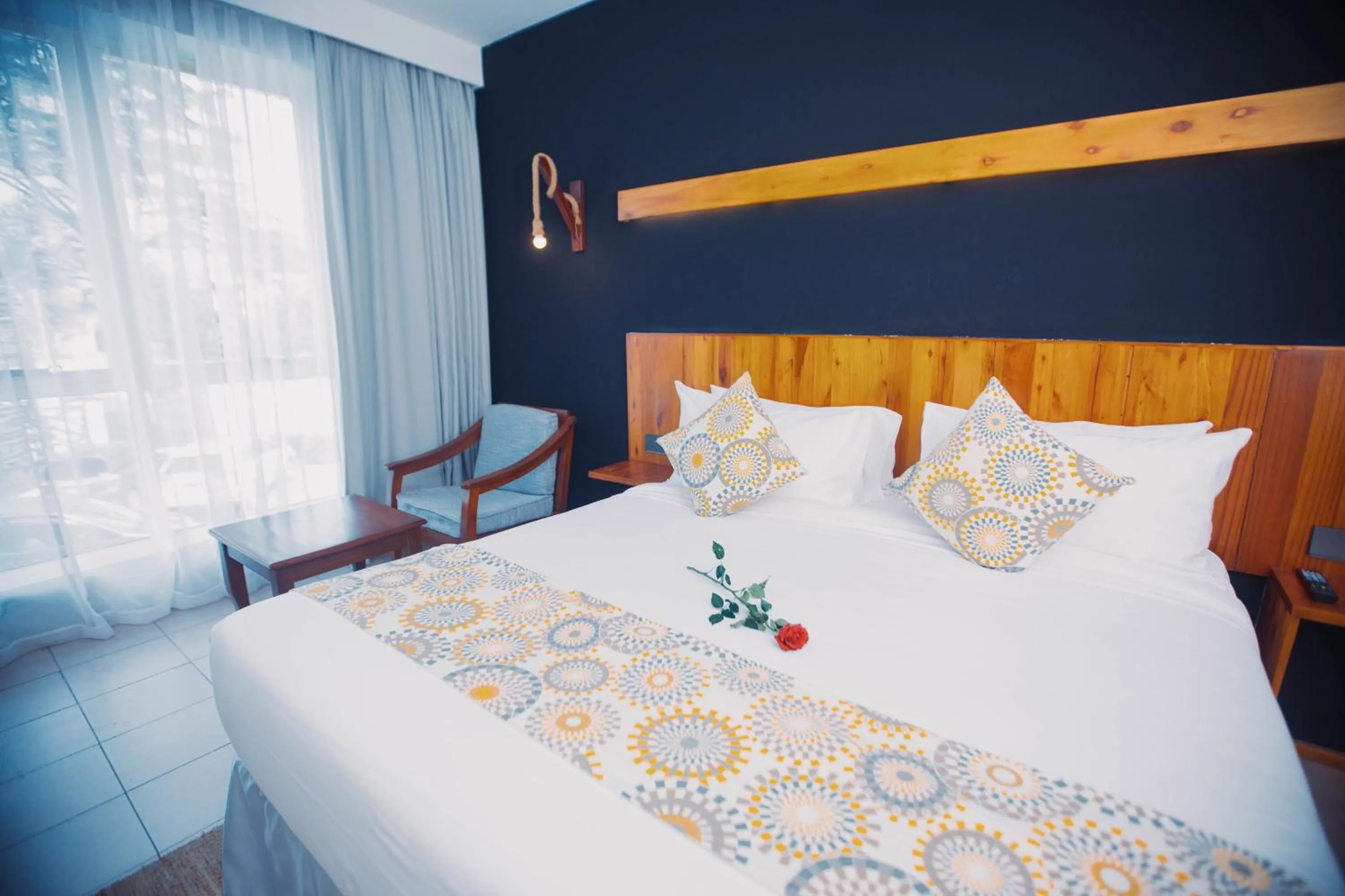 Bed in Giraffe Beach Hotel