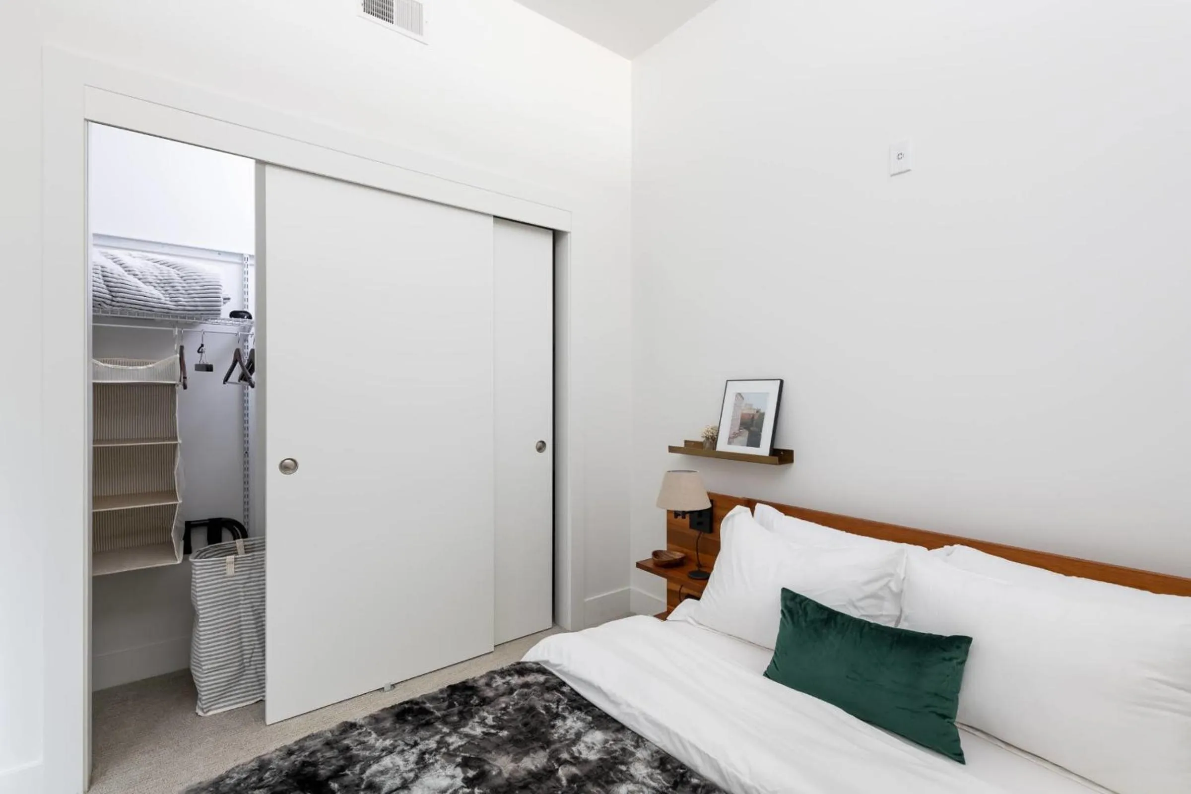 Bed in Modern 1BR Apt with Rooftop, Gym, and Parking