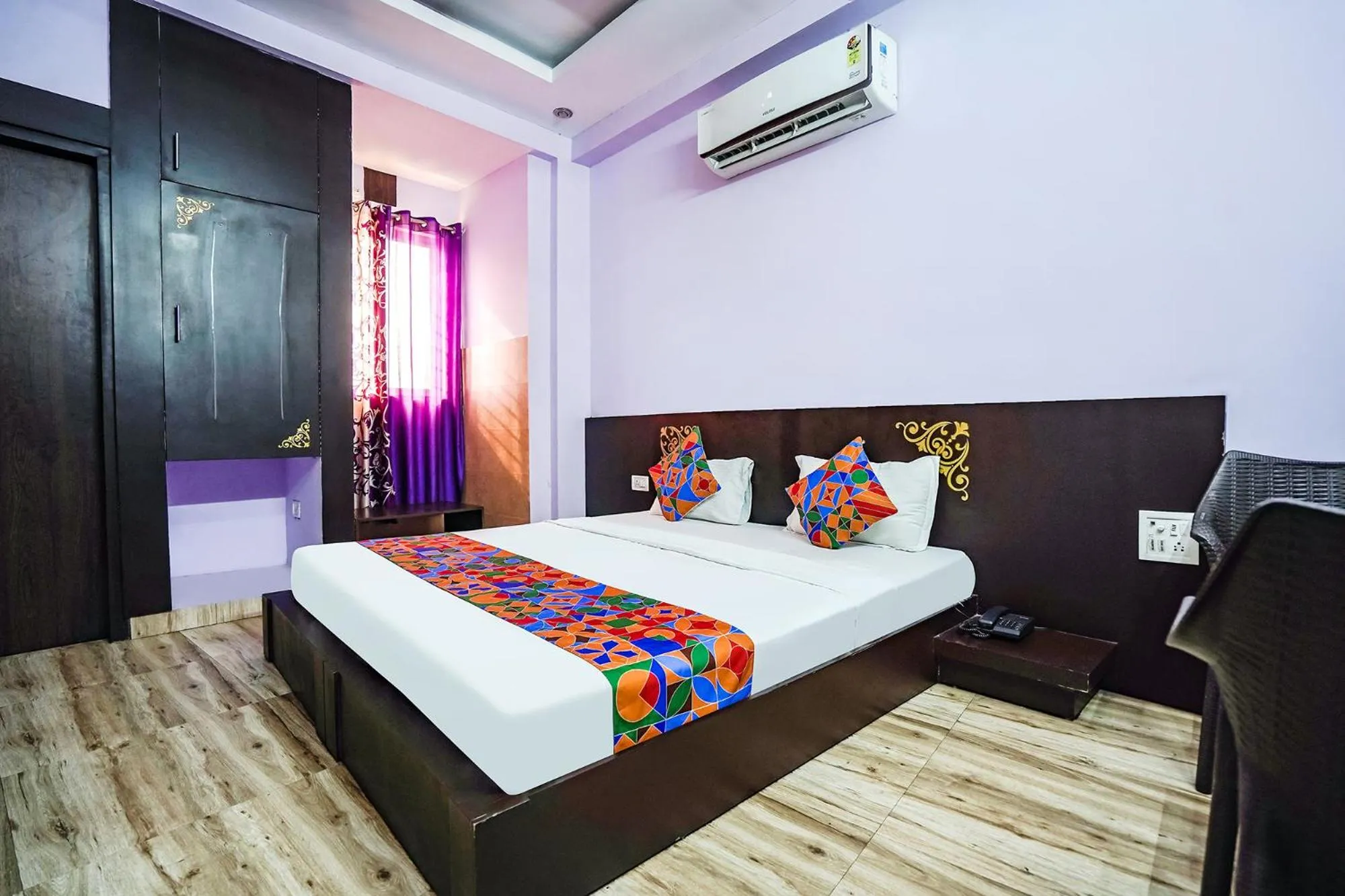 Bed in FabHotel Krishna Heights
