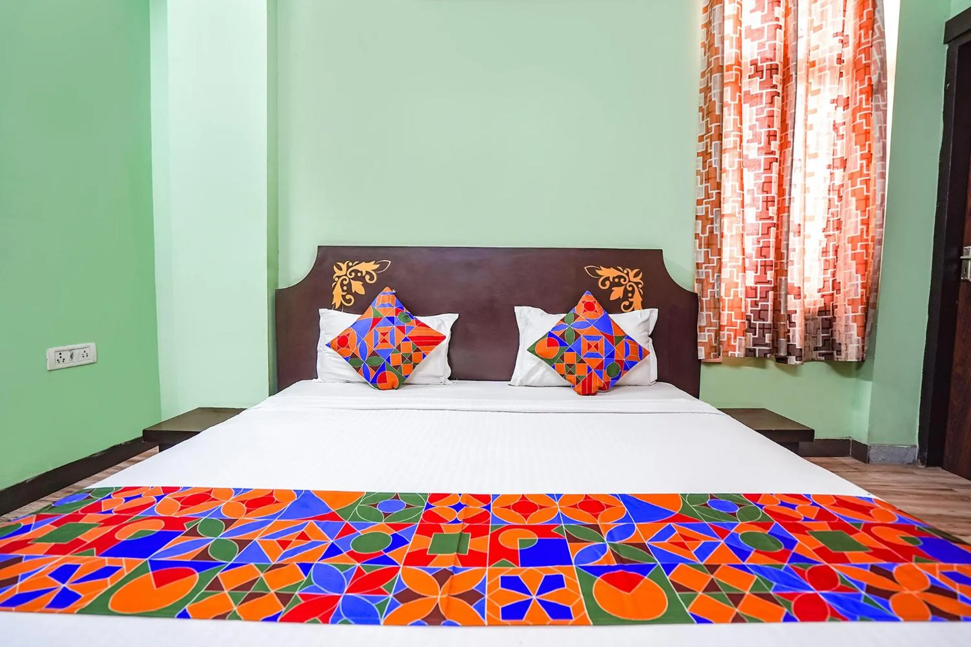 Bed in FabHotel Krishna Heights
