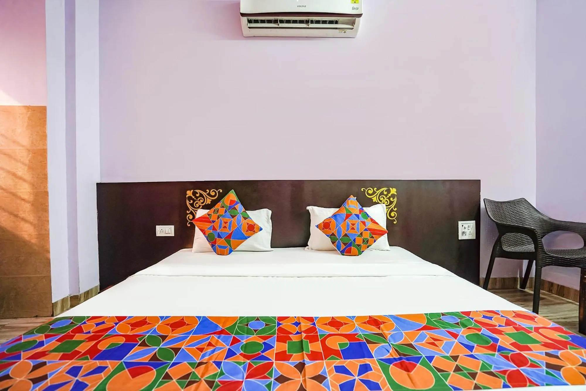 Bed in FabHotel Krishna Heights