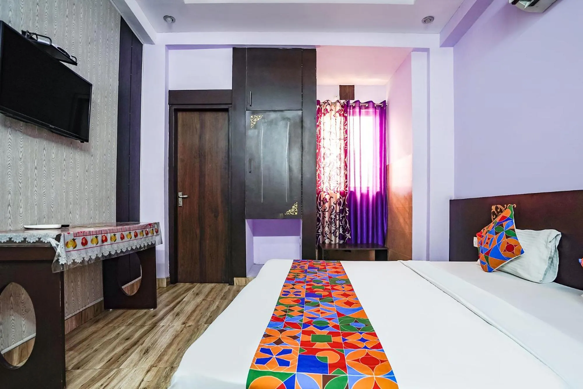 Bed in FabHotel Krishna Heights