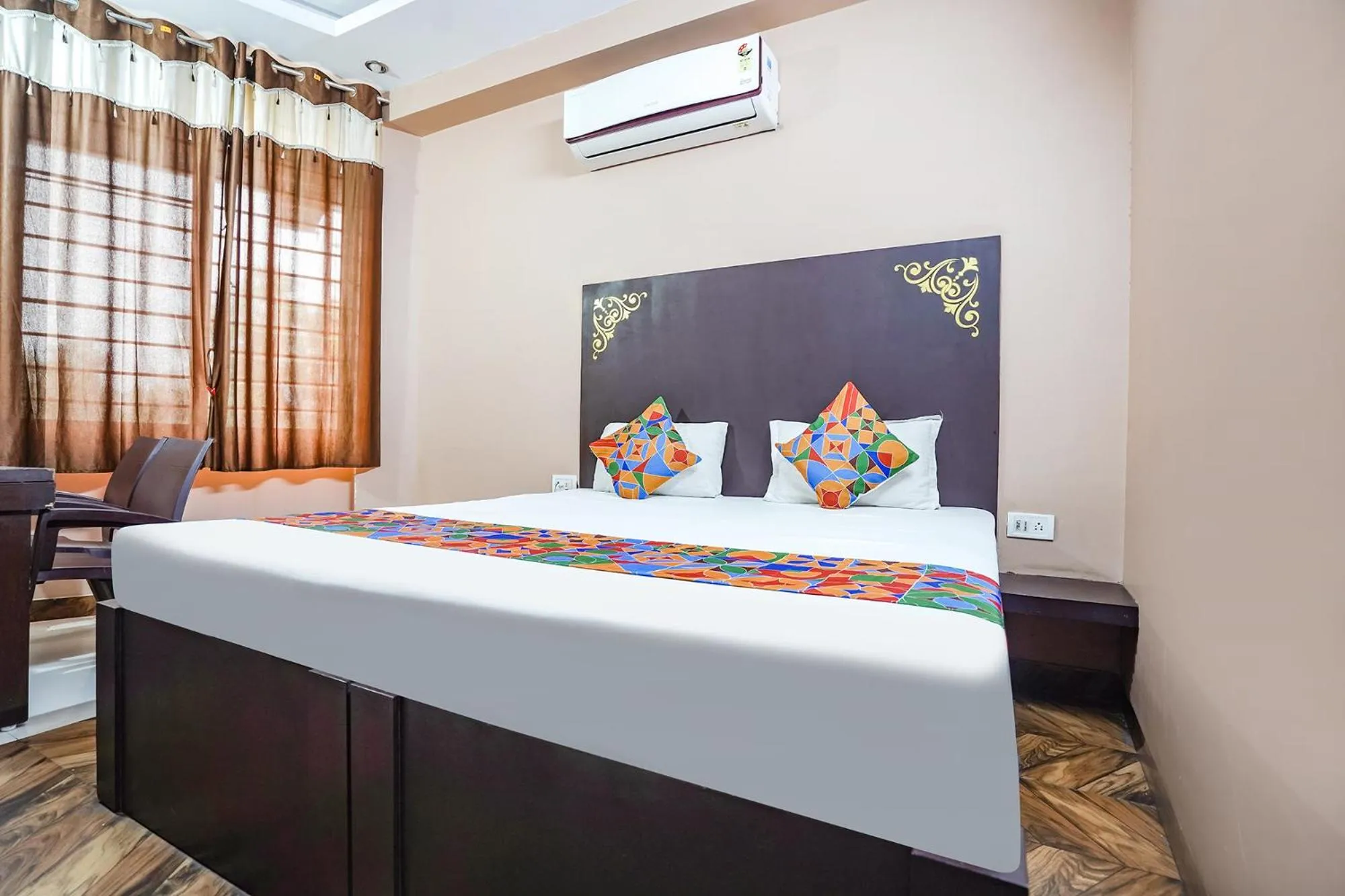 Bed in FabHotel Krishna Heights