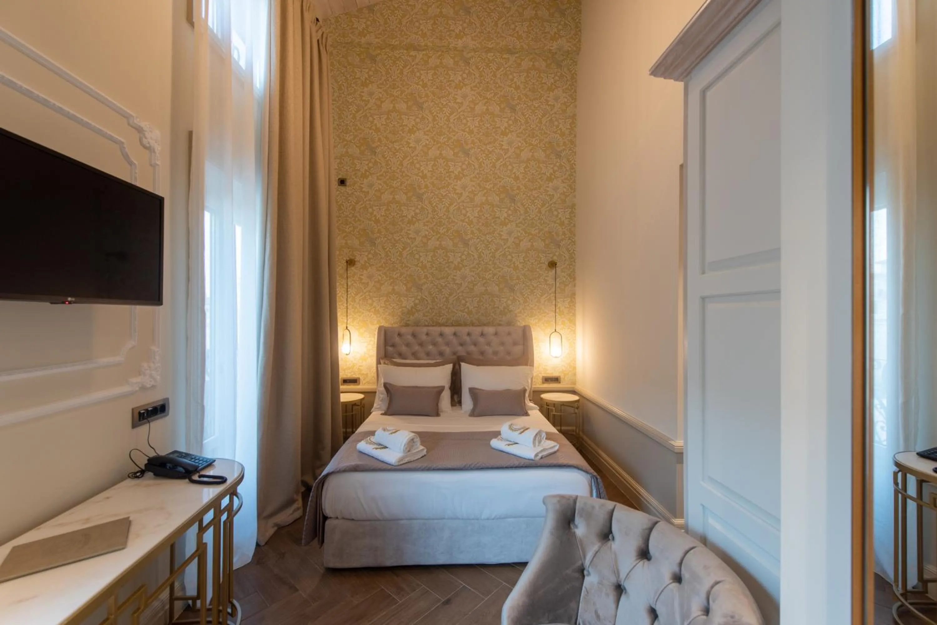 Bed in Capolavoro Suites