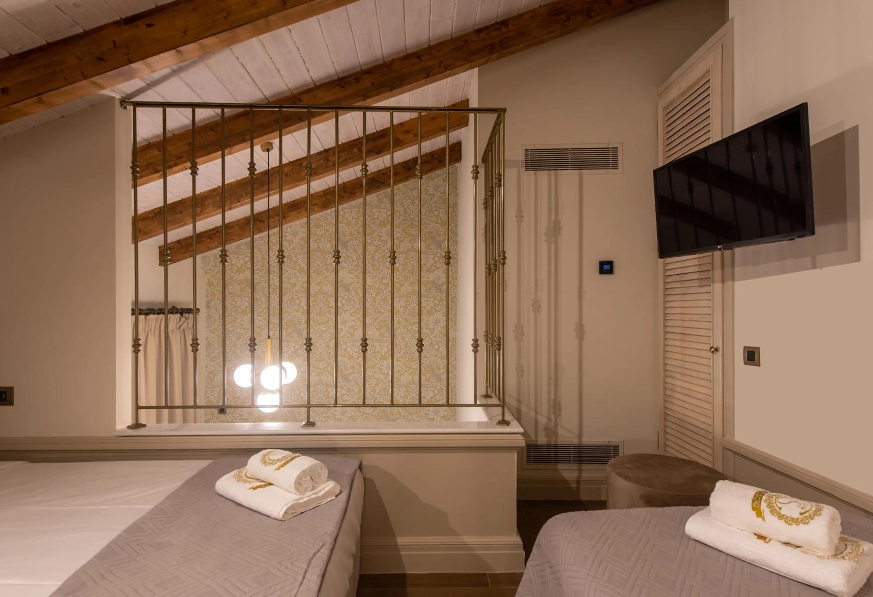 Bed in Capolavoro Suites