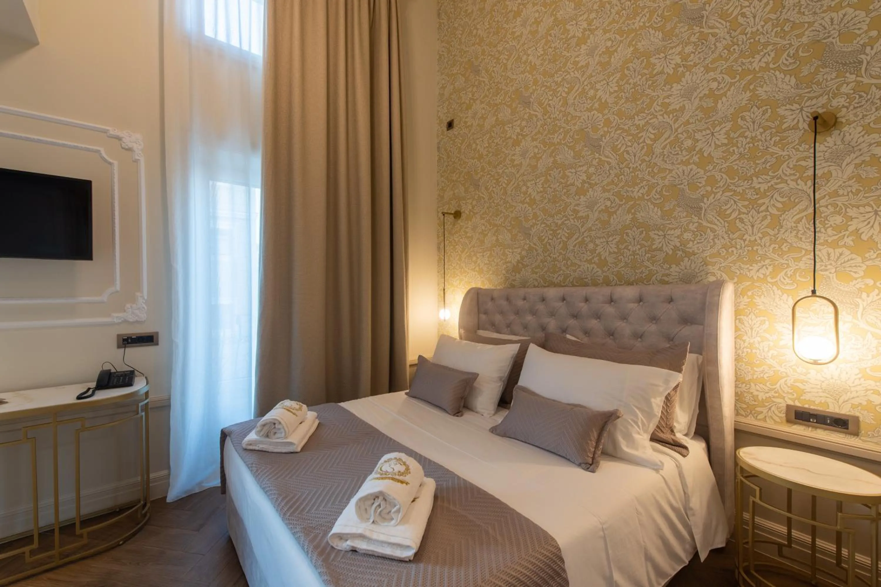 Bed in Capolavoro Suites