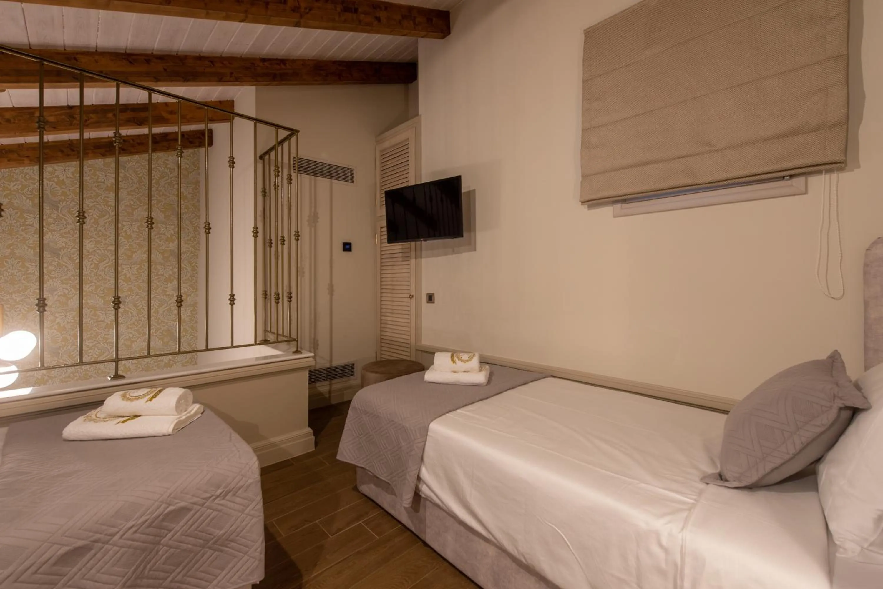 Bed in Capolavoro Suites
