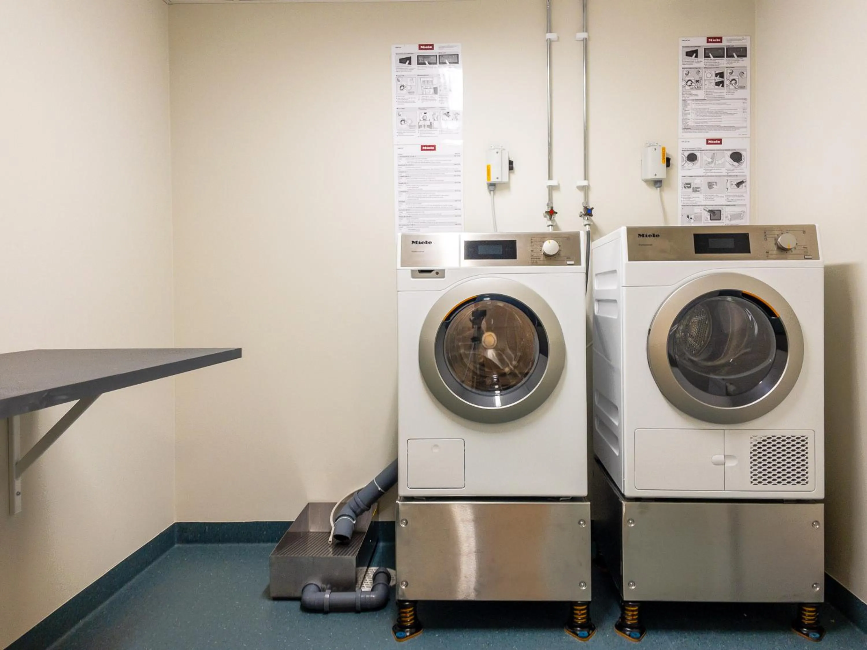 washing machine in Uppsala Hotel Apartments