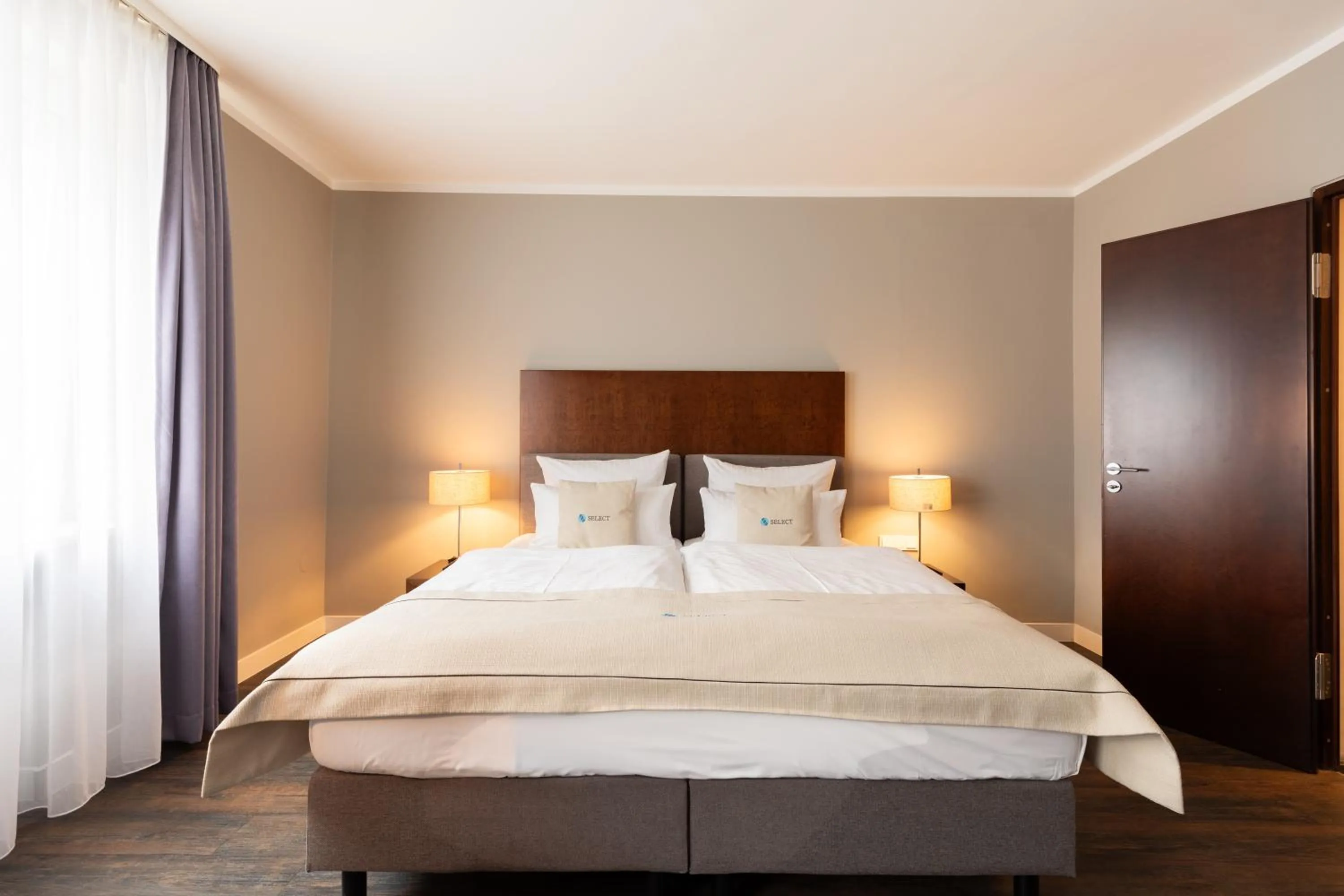 Bed in Select Hotel Friedrichshafen