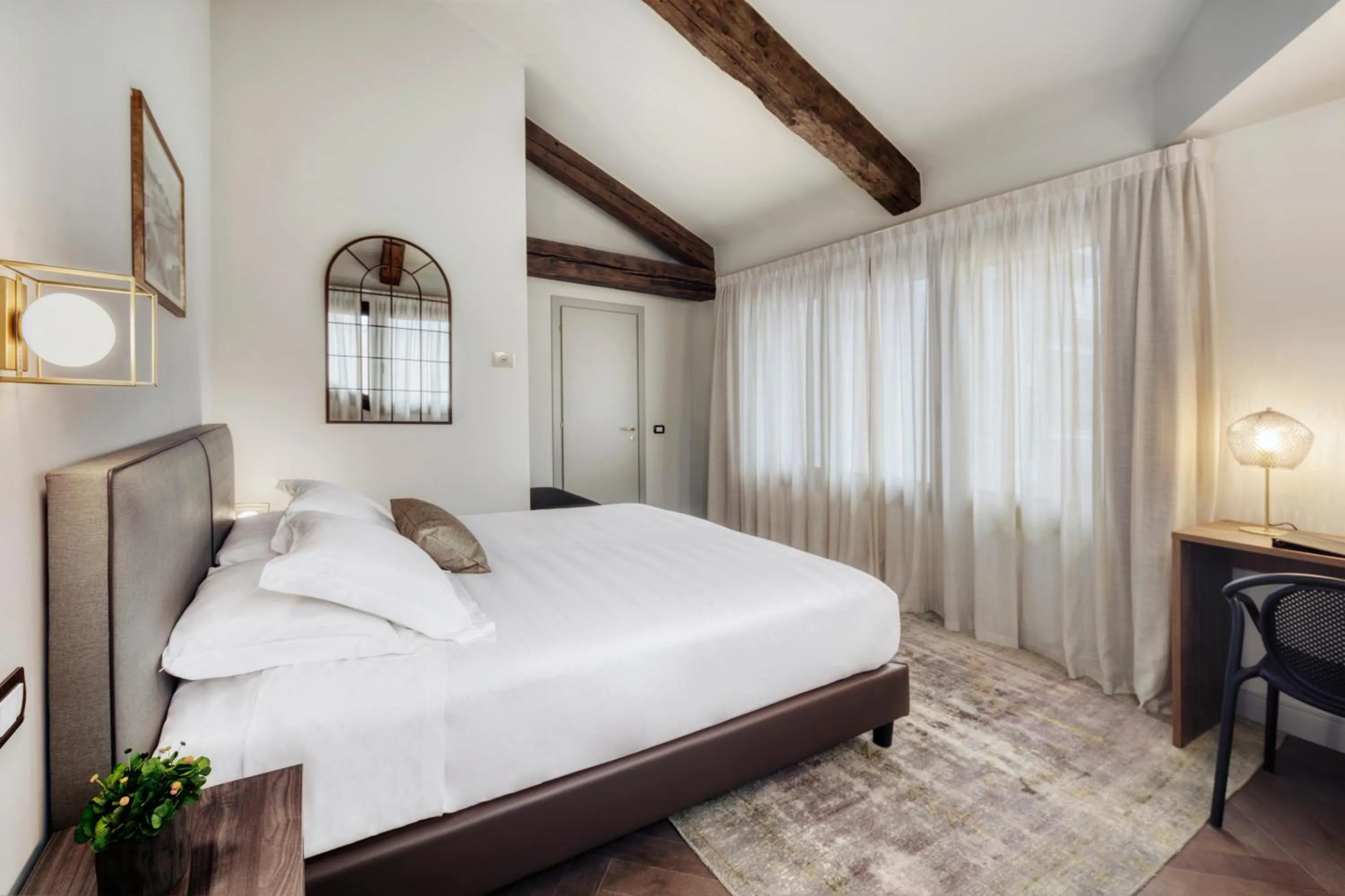 Bed in Porta Altinia Suites