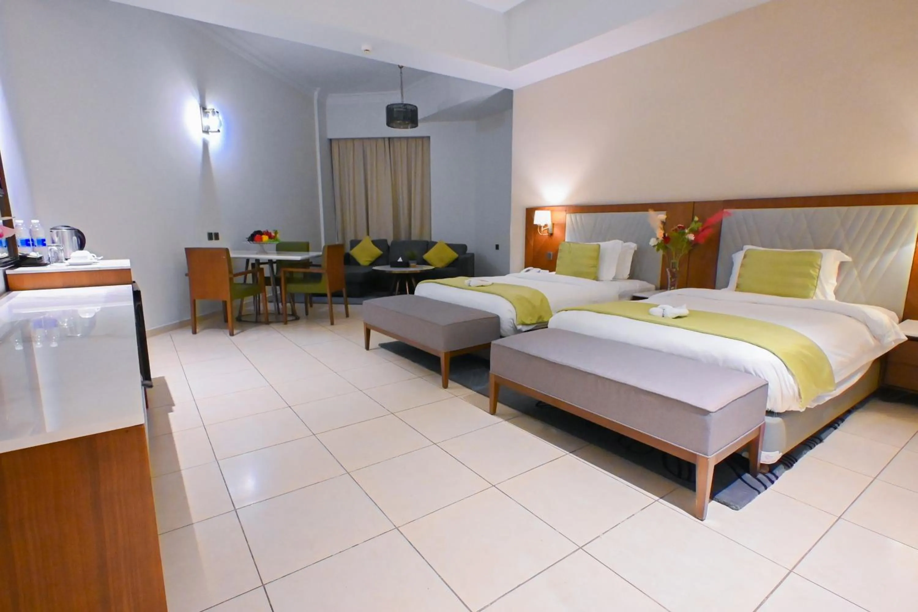 Seating area, Bed in Ramee Palace Hotel